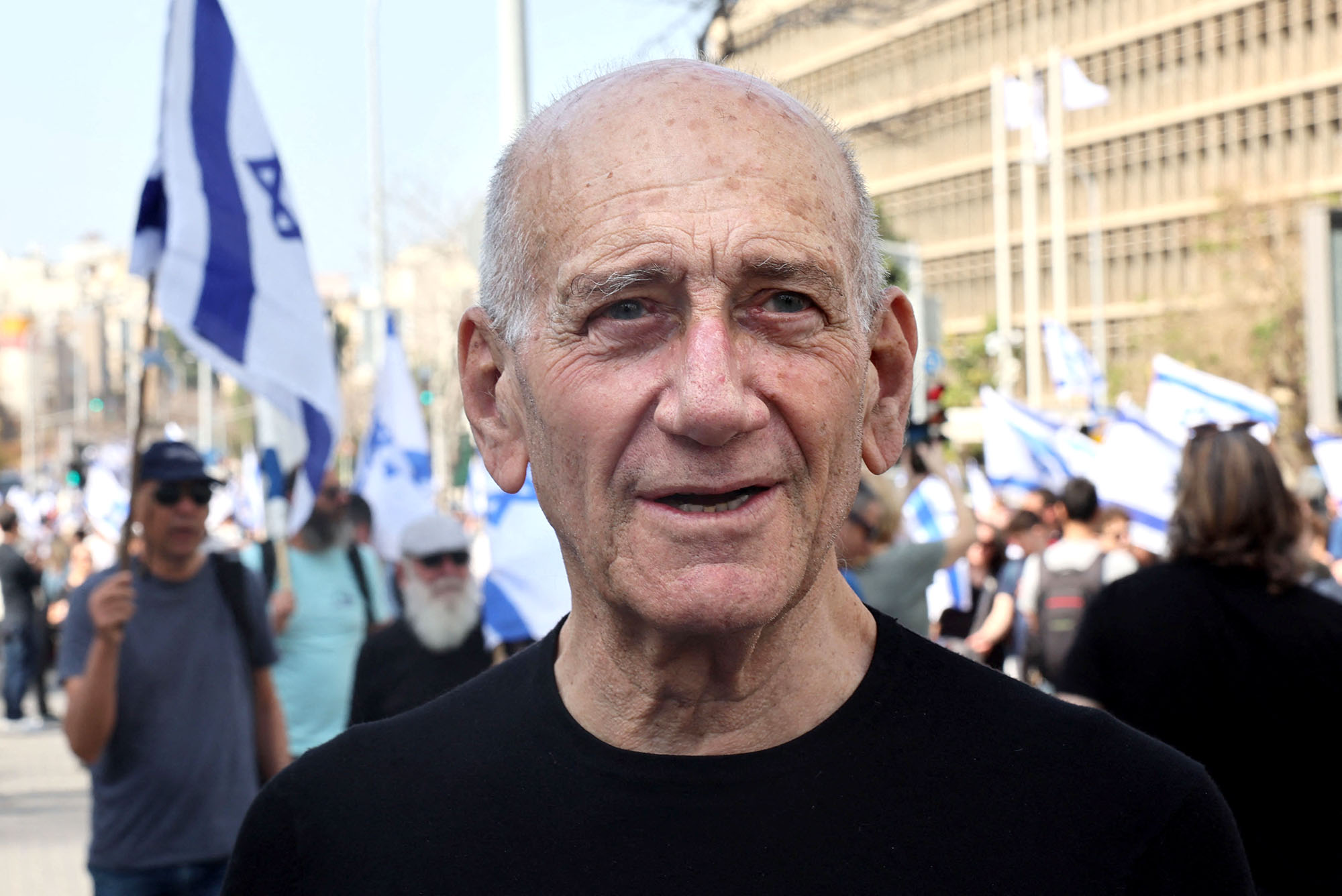 Former Israeli prime minister Ehud Olmert attends a demonstration against the Israeli government's controversial justice reform bill, in Tel Aviv, Israel, on March 1, 2023. 