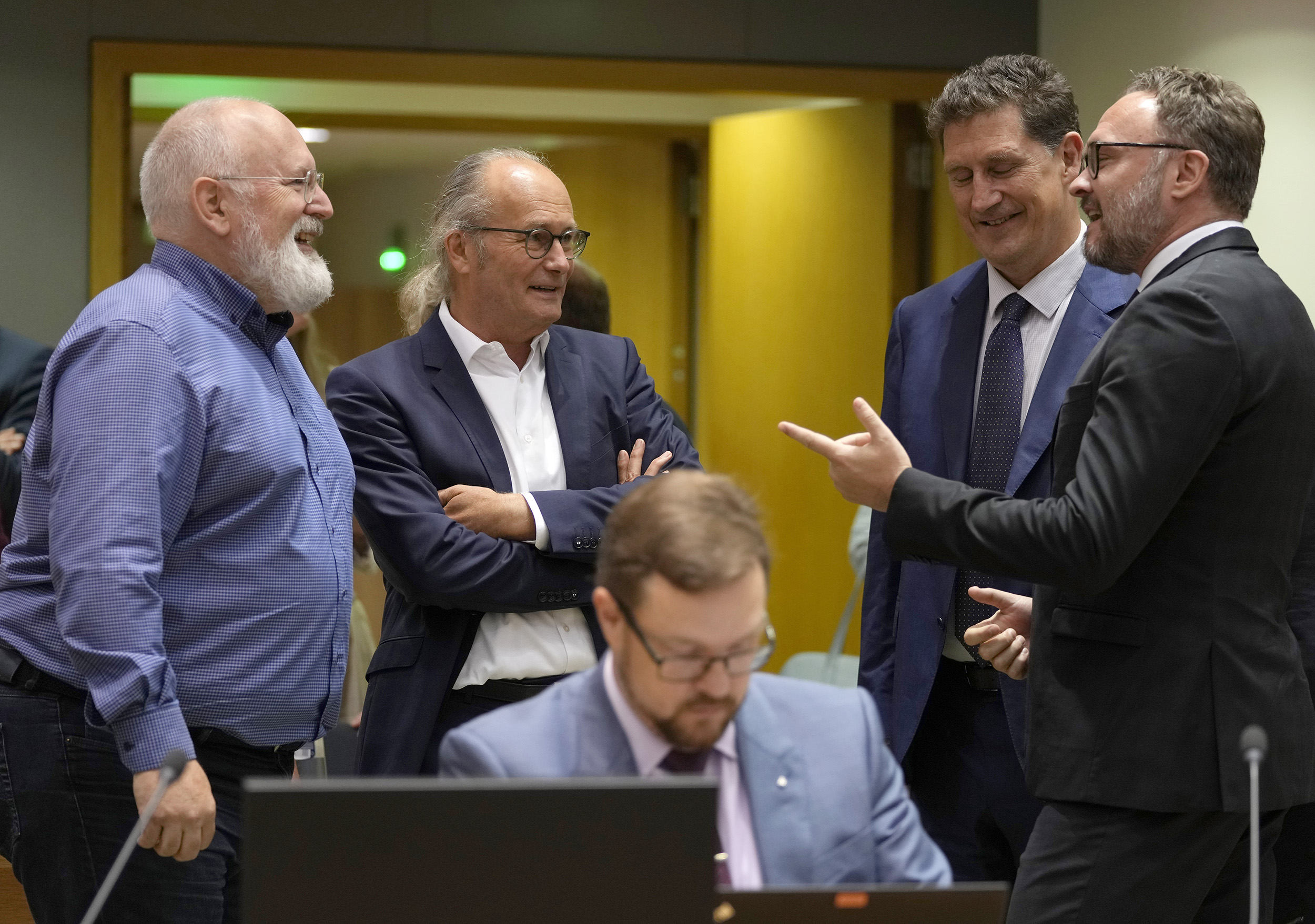 European Commissioner for European Green Deal Frans Timmermans, left, speaks with from left, Luxembourg's Energy Minister Claude Turmes, Ireland's Minister for the Environment Eamon Ryan and Denmark's Minister for Climate Dan Jorgensen during an emergency meeting of EU energy ministers in Brussels, Belgium, on July 26.