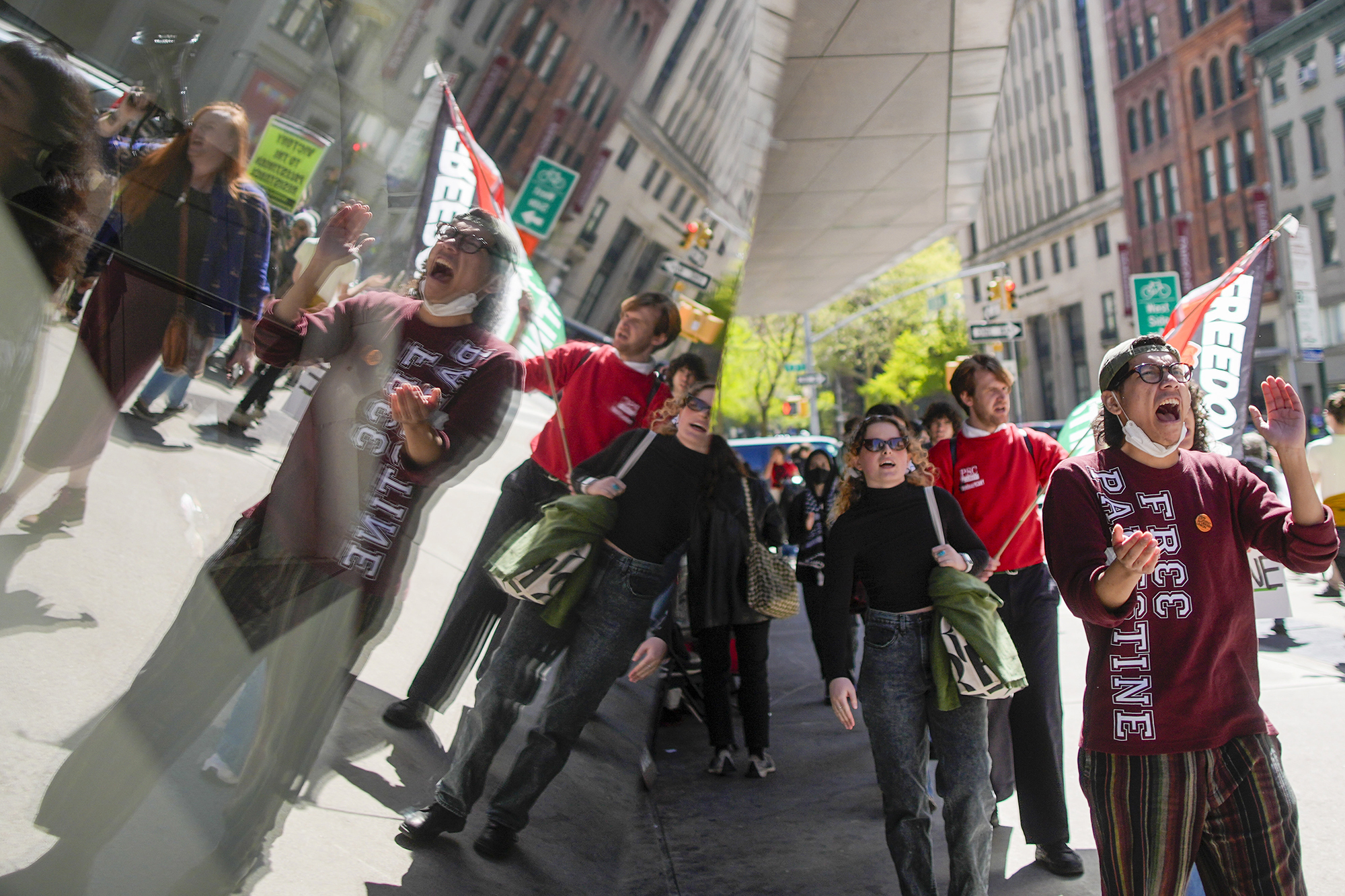 The New School students and pro-Palestinian supporters rally outside The New School University Center building, Monday, April 22, 2024, in New York. 