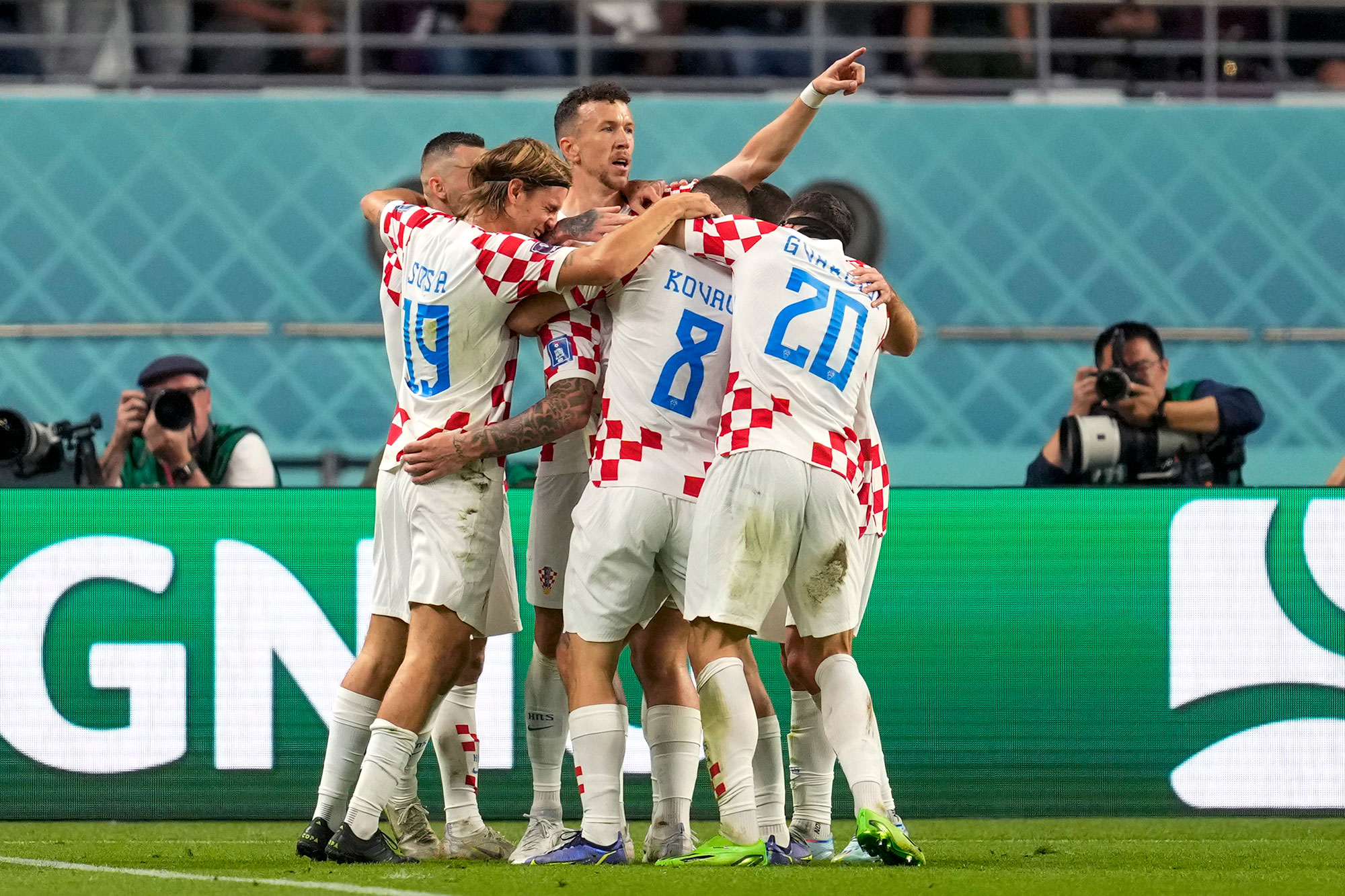 Croatia's players celebrate their second goal against Canada on Sunday. 