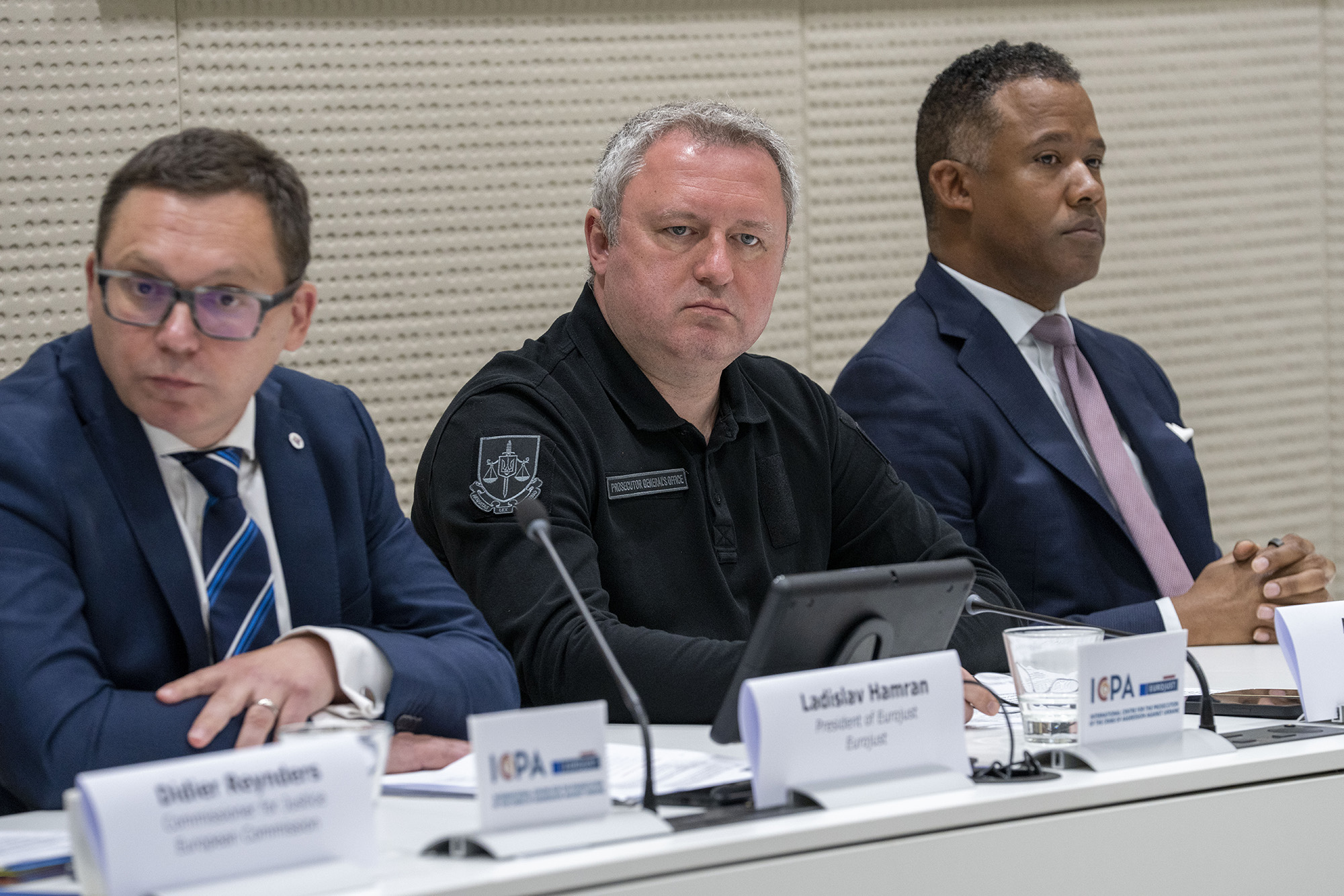 Ladislav Hamran, left, President of Eurojust, Andriy Kostin, center, Prosecutor General of the Ukraine, and Kenneth A. Polite Jr., Assistant Attorney General, of the U.S., attend a joint press conference in The Hague, Netherlands, on July 3.