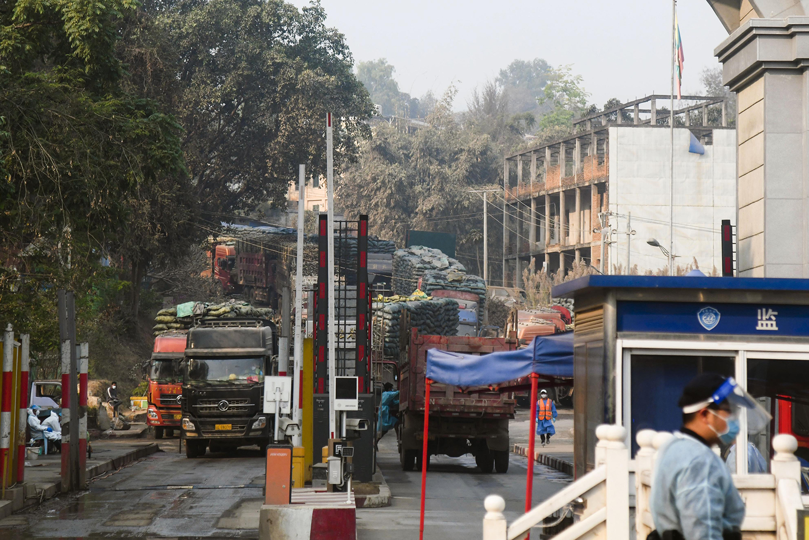 Before the lockdown, trucks are seen coming and going at a border post in Ruili, China, on March 27.
