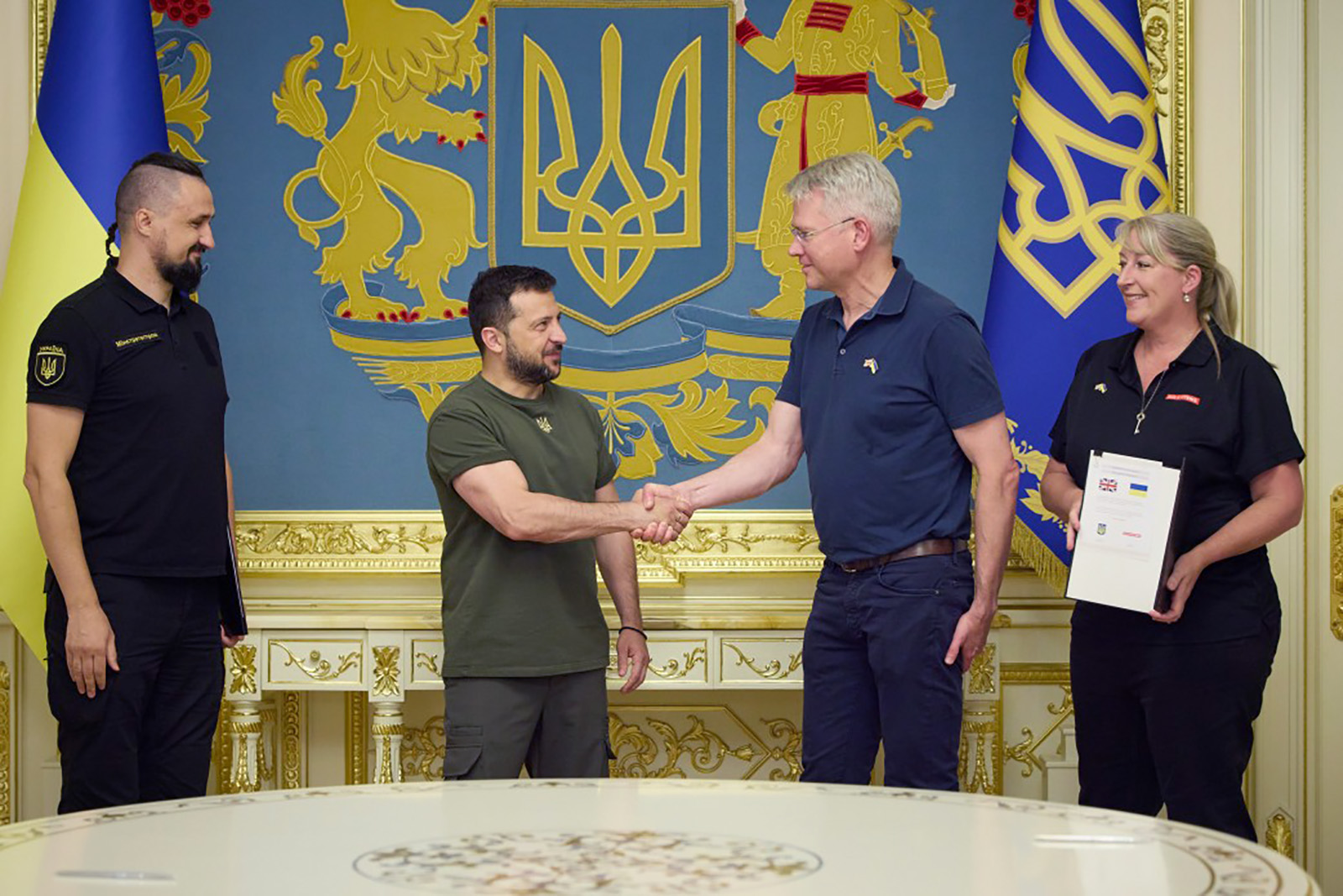 President of Ukraine Volodymyr Zelensky, center left, meets with representatives of BAE Systems CEO Charles Woodburn, center right, in Kyiv, Ukraine on August 31.