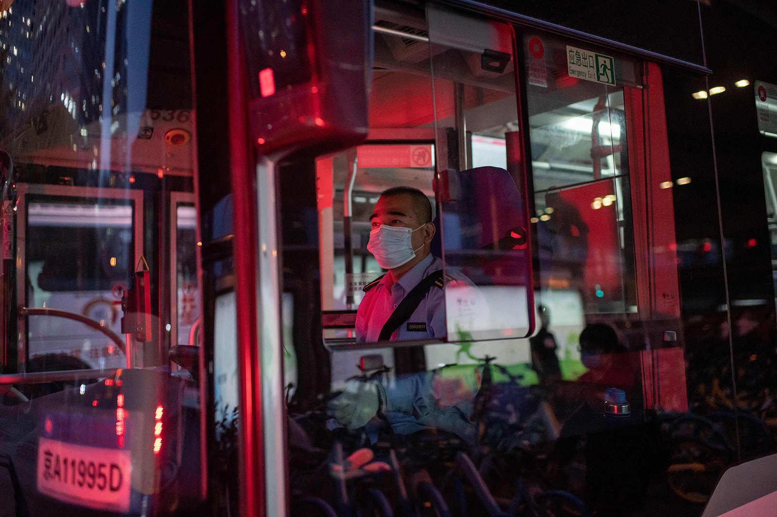 A bus driver arrives at a bus terminal during the evening rush hour in Beijing, on September 22.