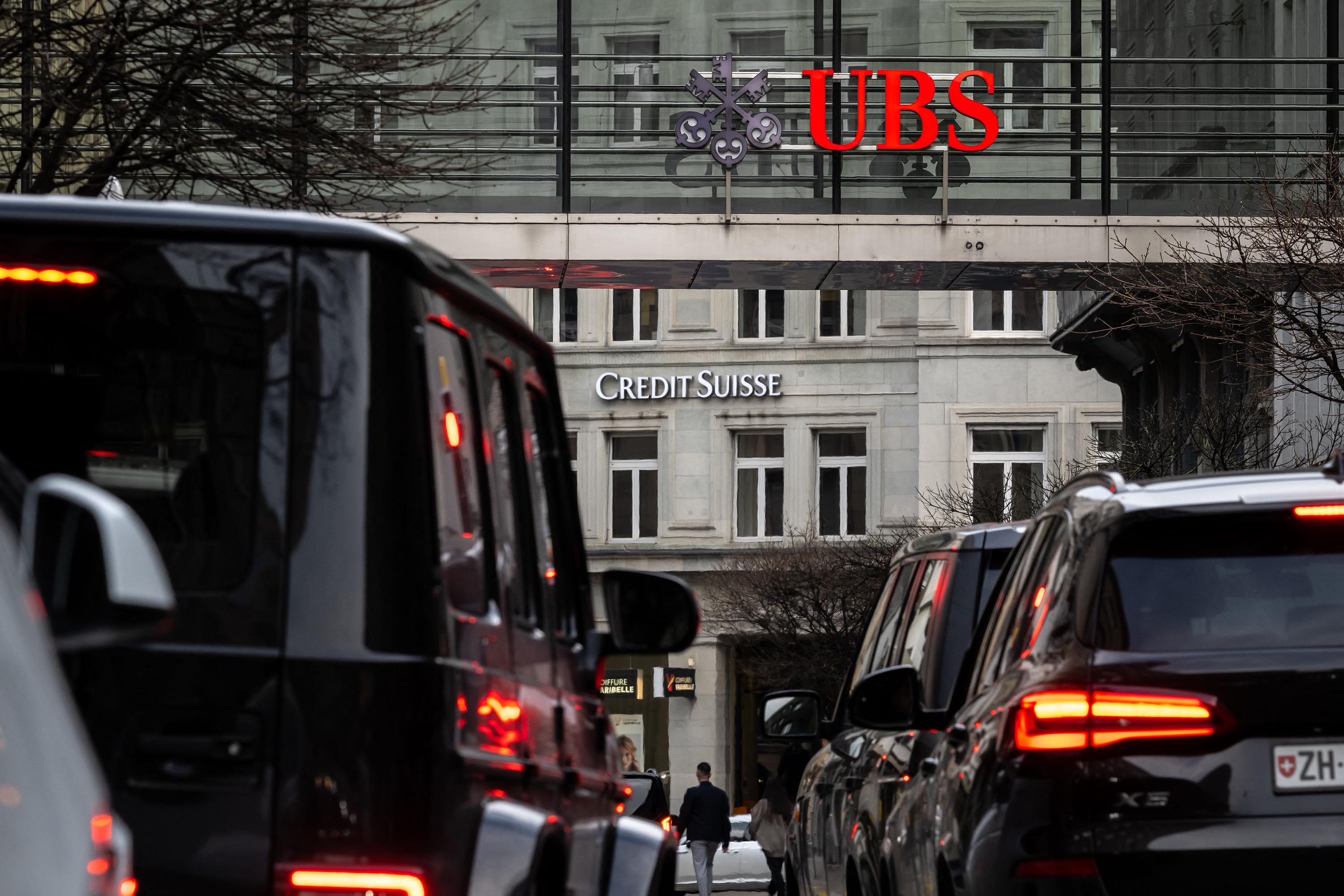 Signs for UBS and Credit Suisse banks are seen in Zurich, Switzerland, on March 18. 