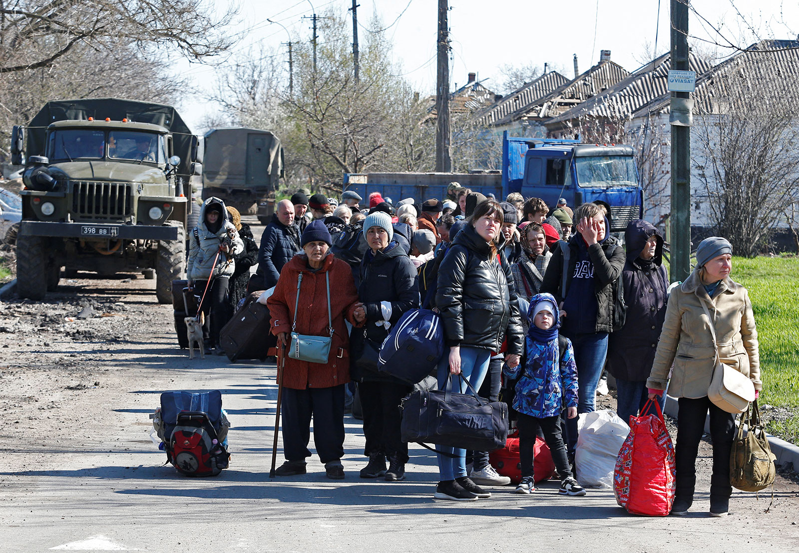 Evacuees wait to board a bus to leave Mariupol, Ukraine, on Wednesday, April 20. 