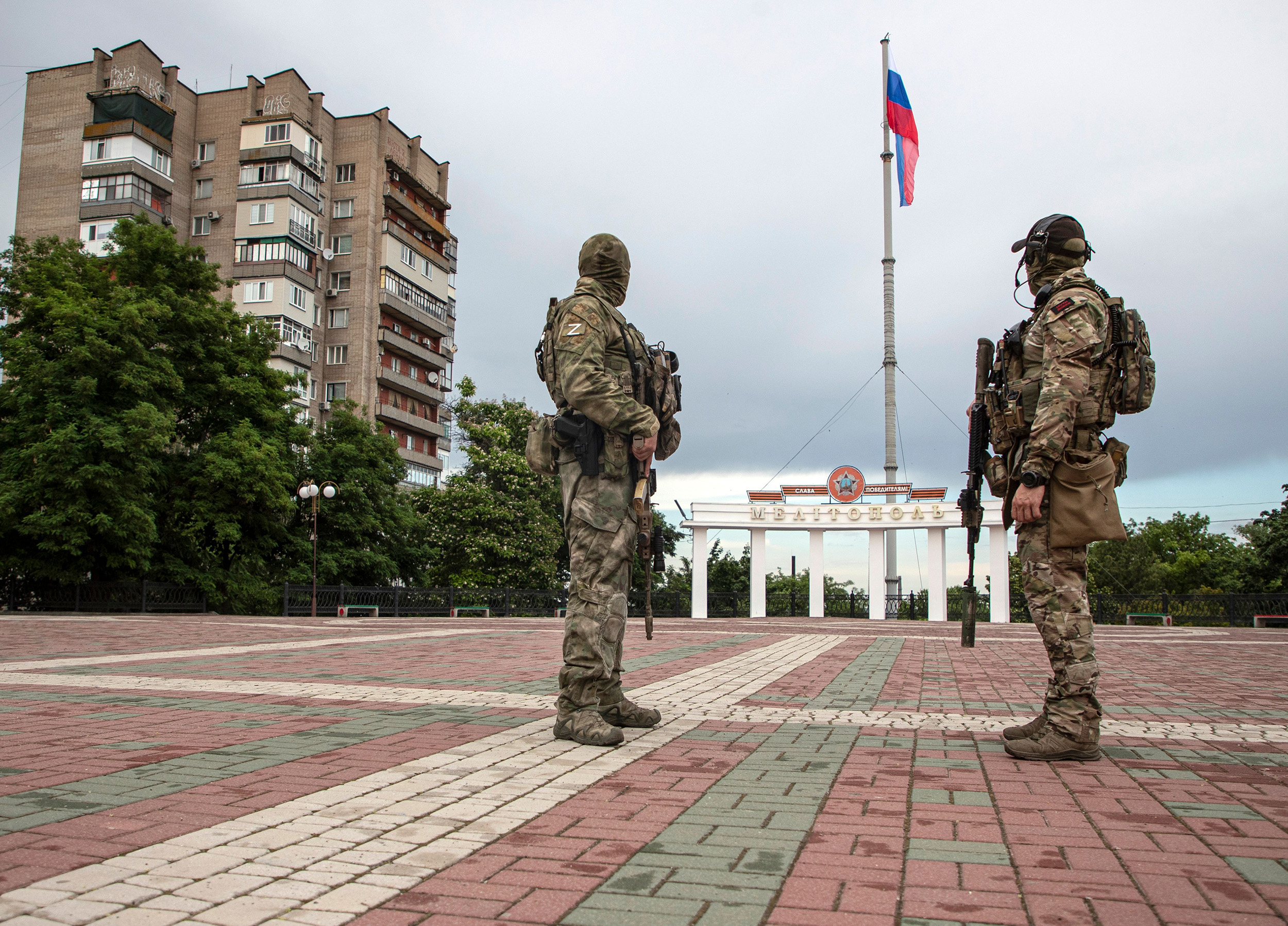 Russian servicemen keep watch in the main square of Melitopol, Zaporizhia region, Ukraine, on June 14.