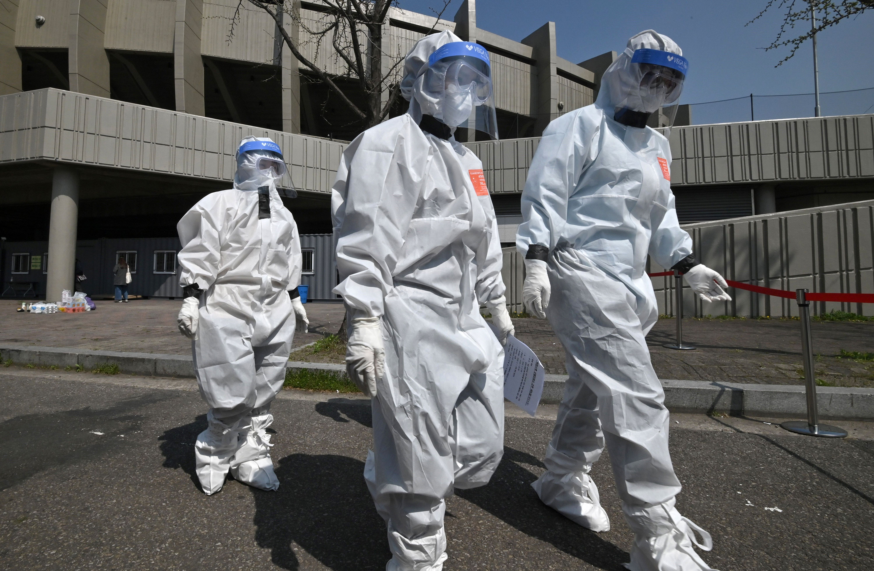 Seoul city officials arrive at a coronavirus testing station at Jamsil Sports Complex in Seoul, on April 3.