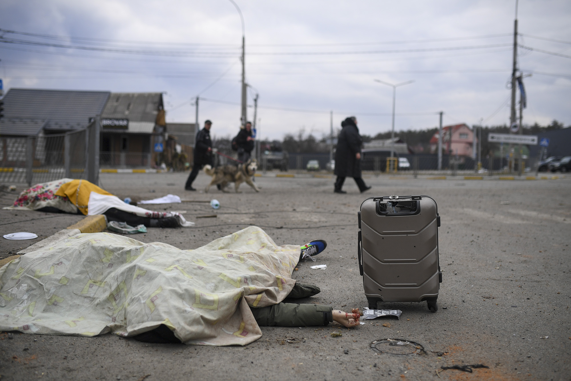 Dead bodies lie covered on the streets of Irpin, Ukraine, on March 6.
