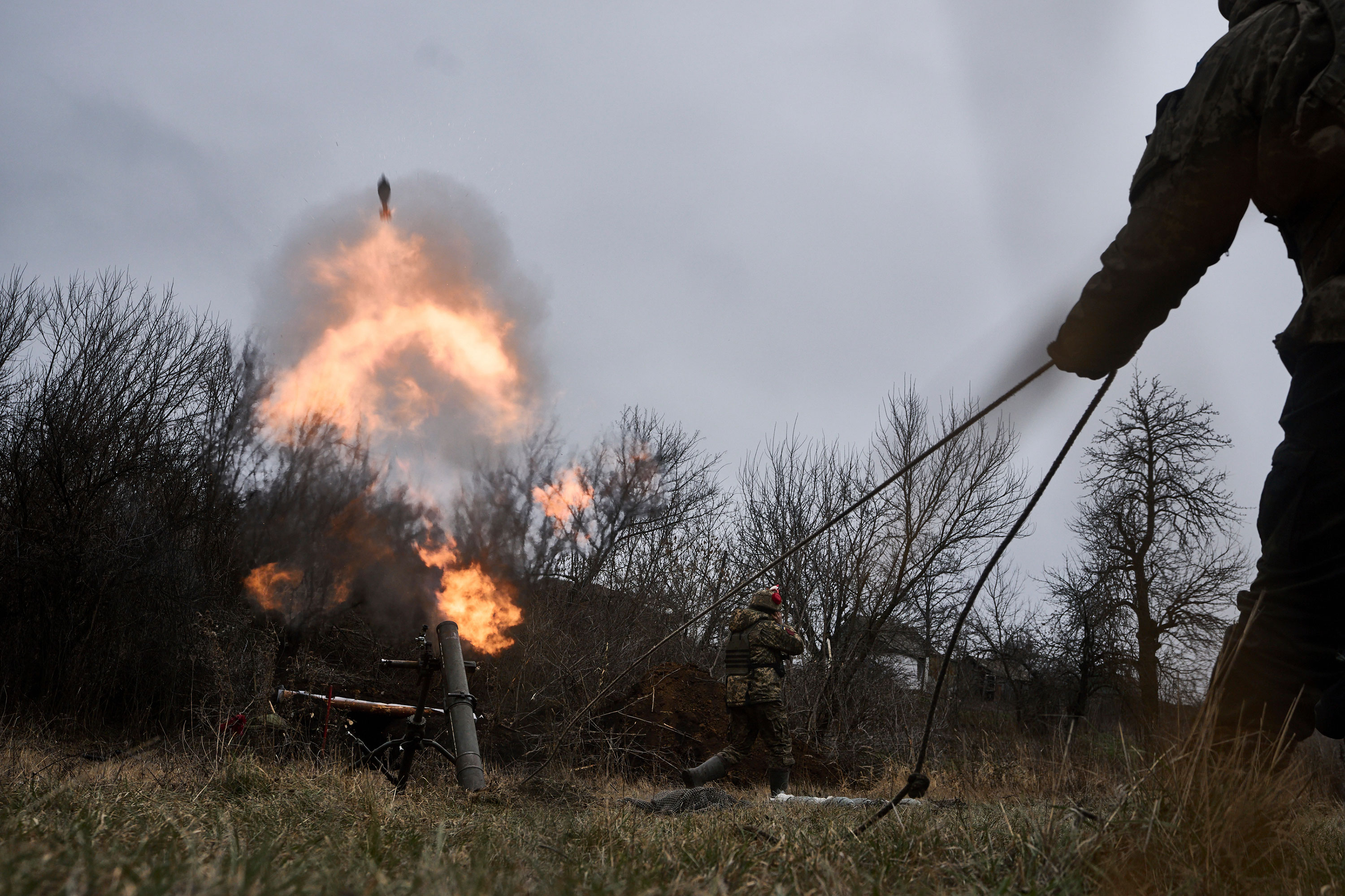 Ukrainian soldiers fire a mortar towards Russian positions Thursday near Bakhmut.