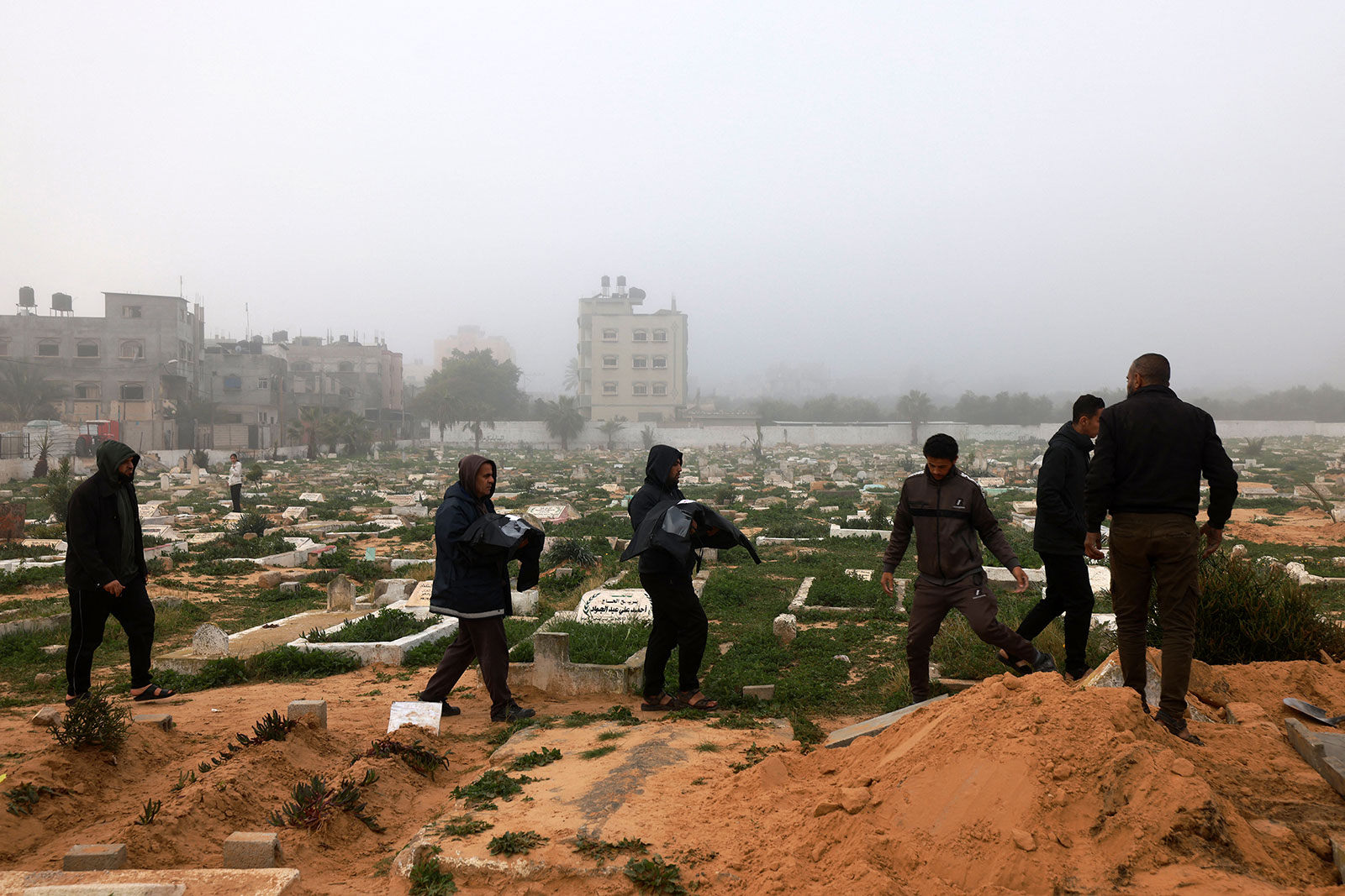 Mourners carry bodies of those killed from a strike in Rafah during a funeral on February 9, 2024.