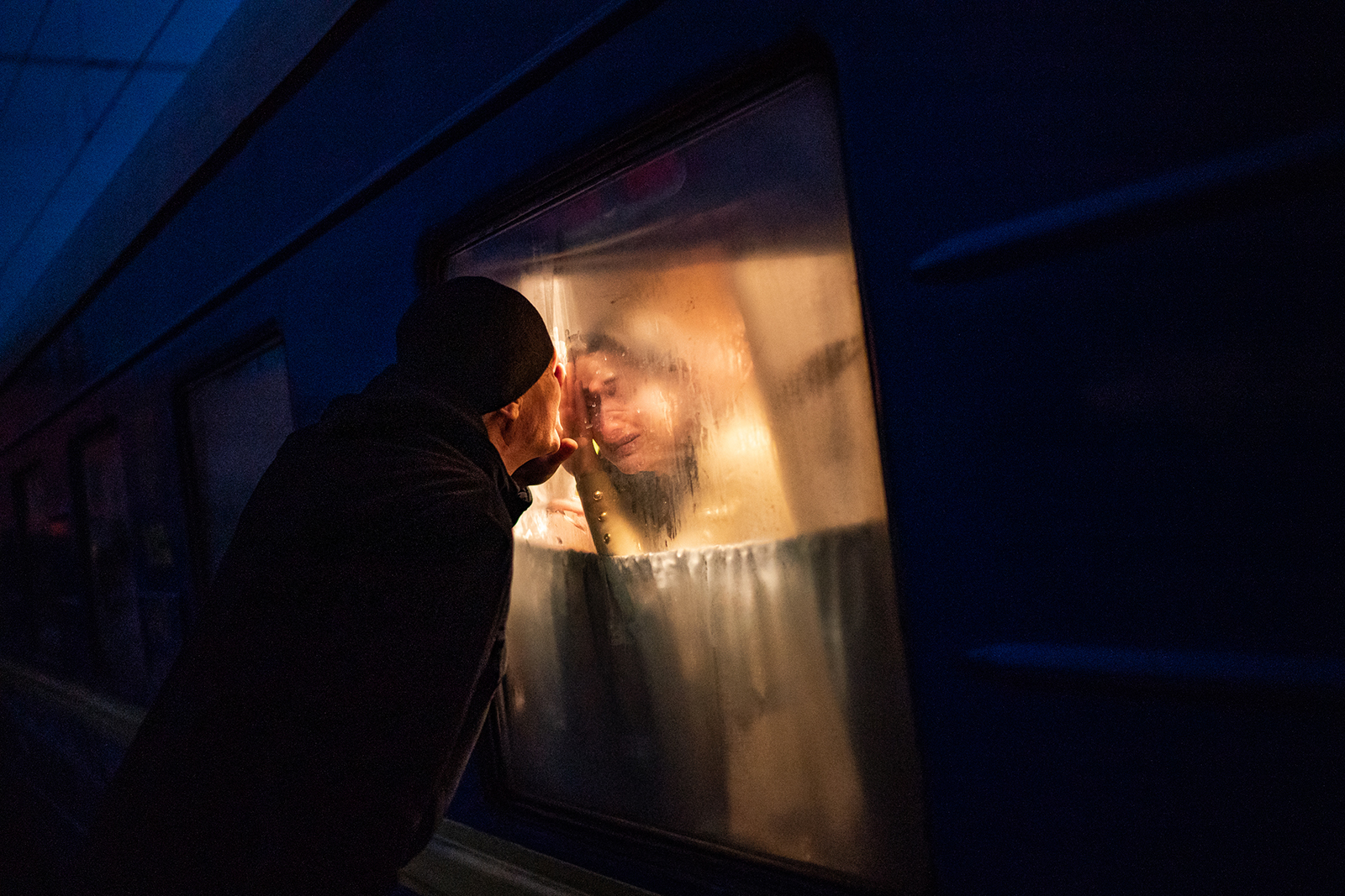 George Keburia says goodbye to his wife and children as they board a train to Lviv in Odessa, Ukraine, on Saturday, March 5.
