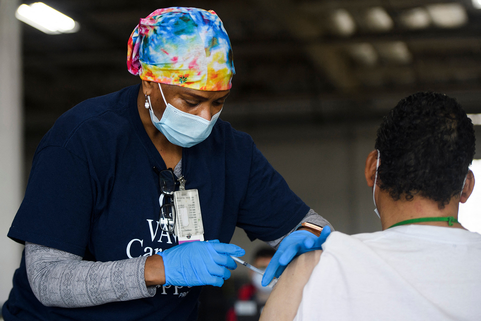 A registered nurse administers a dose of the Moderna Covid-19 vaccine on April 17, in Gardena, California.