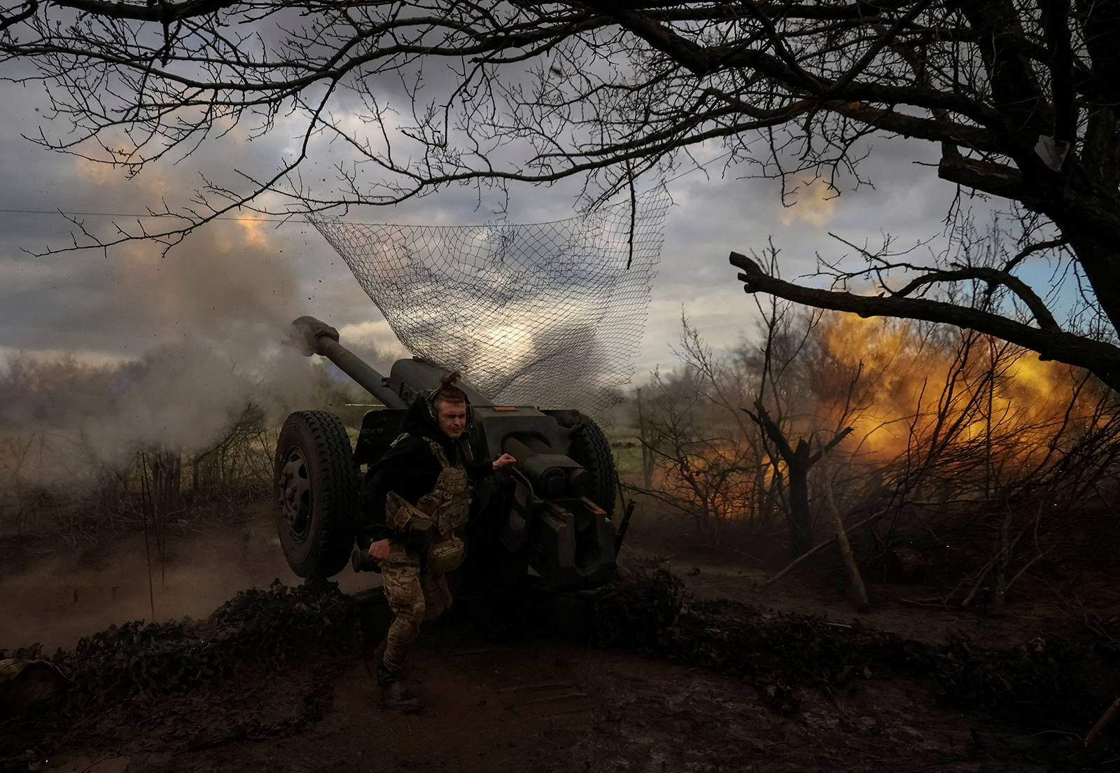 Ukrainian service members from a 3rd separate assault brigade of the Armed Forces of Ukraine, fire a howitzer D30 at a front line near the city of Bakhmut, Ukraine on April 23.