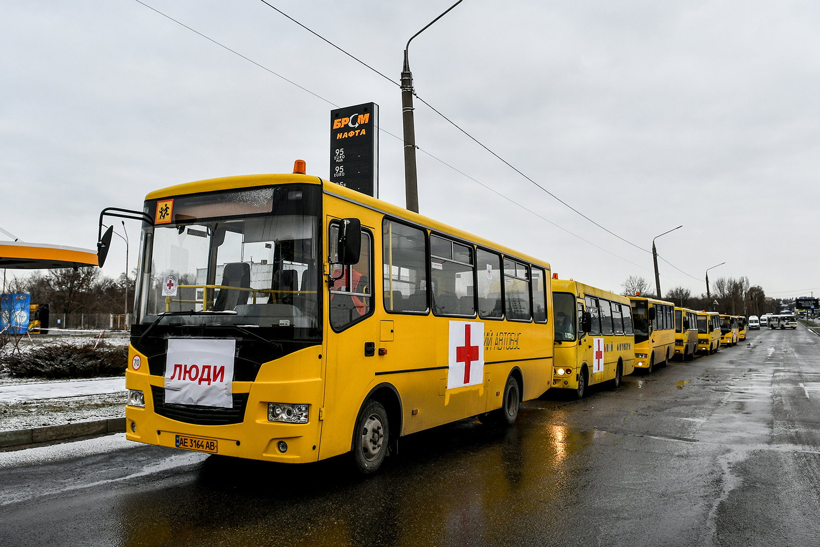 A convoy of buses featuring red crosses waits to journey to Mariupol to deliver humanitarian aid and evacuate people should the green corridor be confirmed, Zaporizhzhia, Ukraine, on March 6.