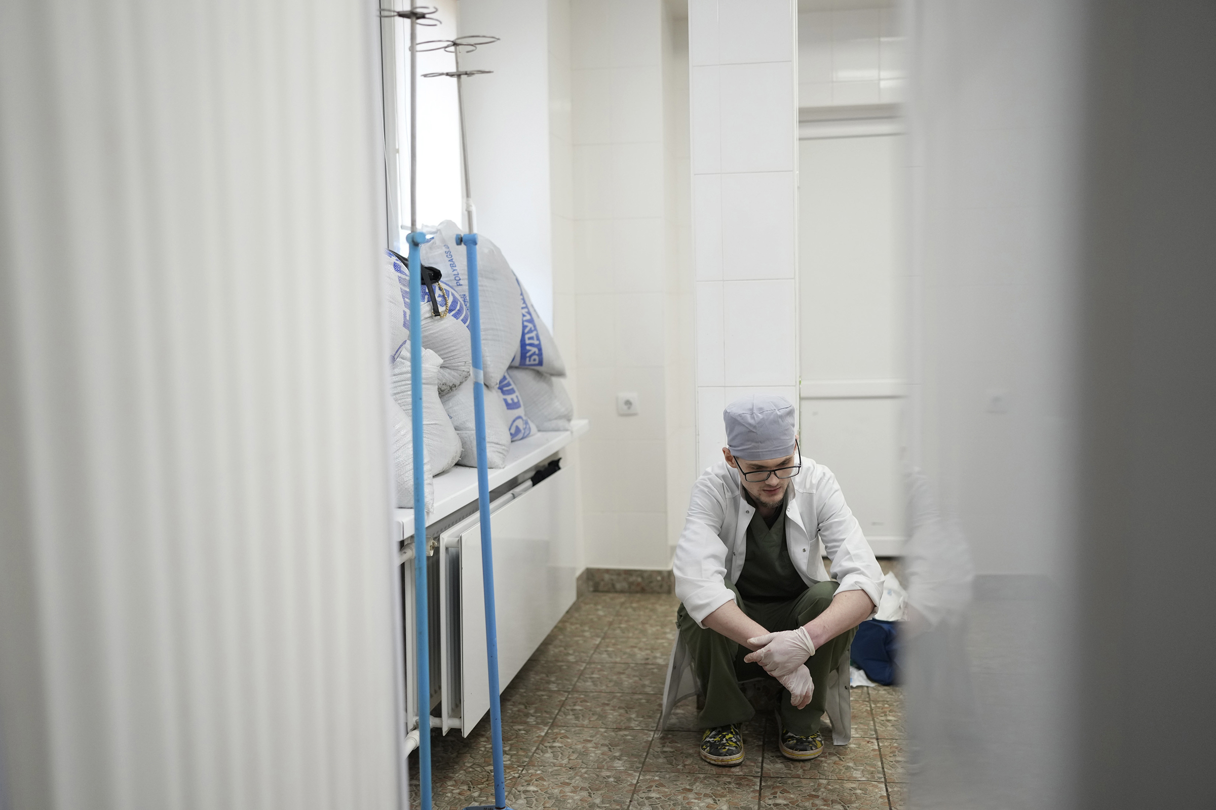 A medical worker reacts after 18 month-old Kirill dies.