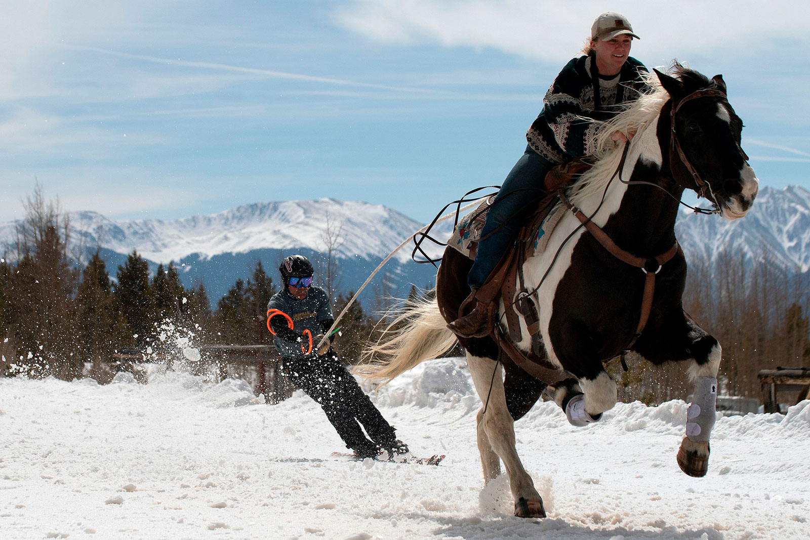 People participate in a skijoring race in Leadville, Colorado, in March 2021.