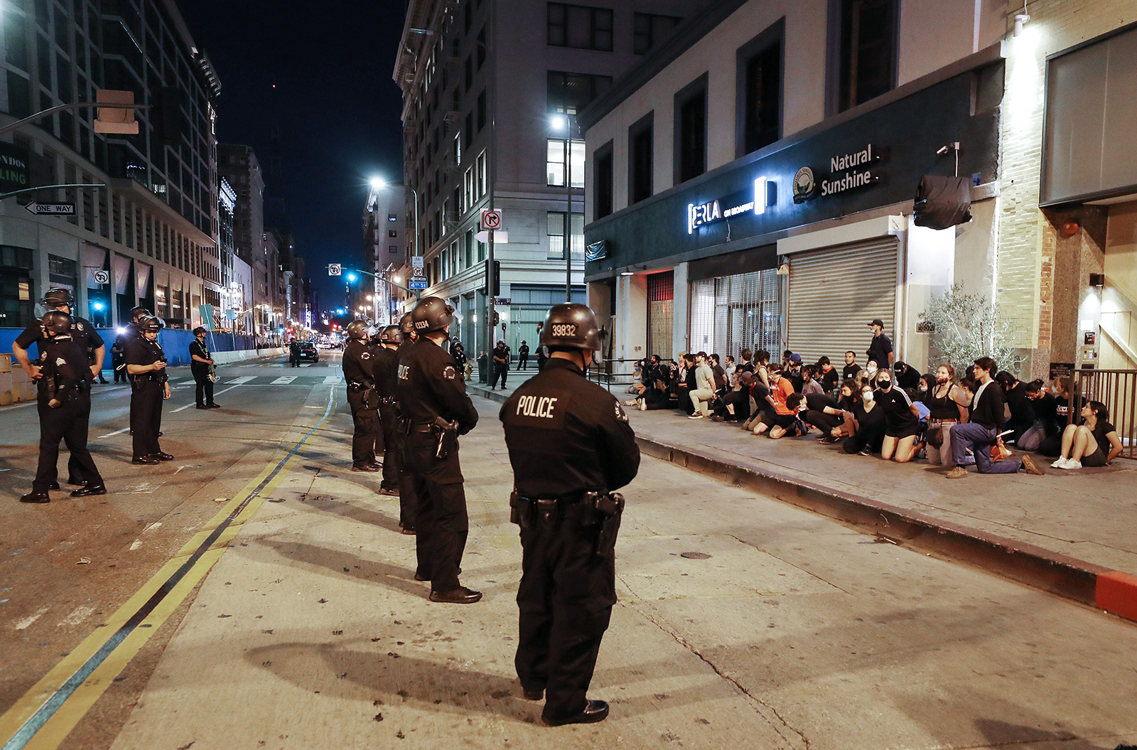 Protestors are arrested downtown by police after curfew went into effect during demonstrations over George Floyd’s death on June 2, in Los Angeles.