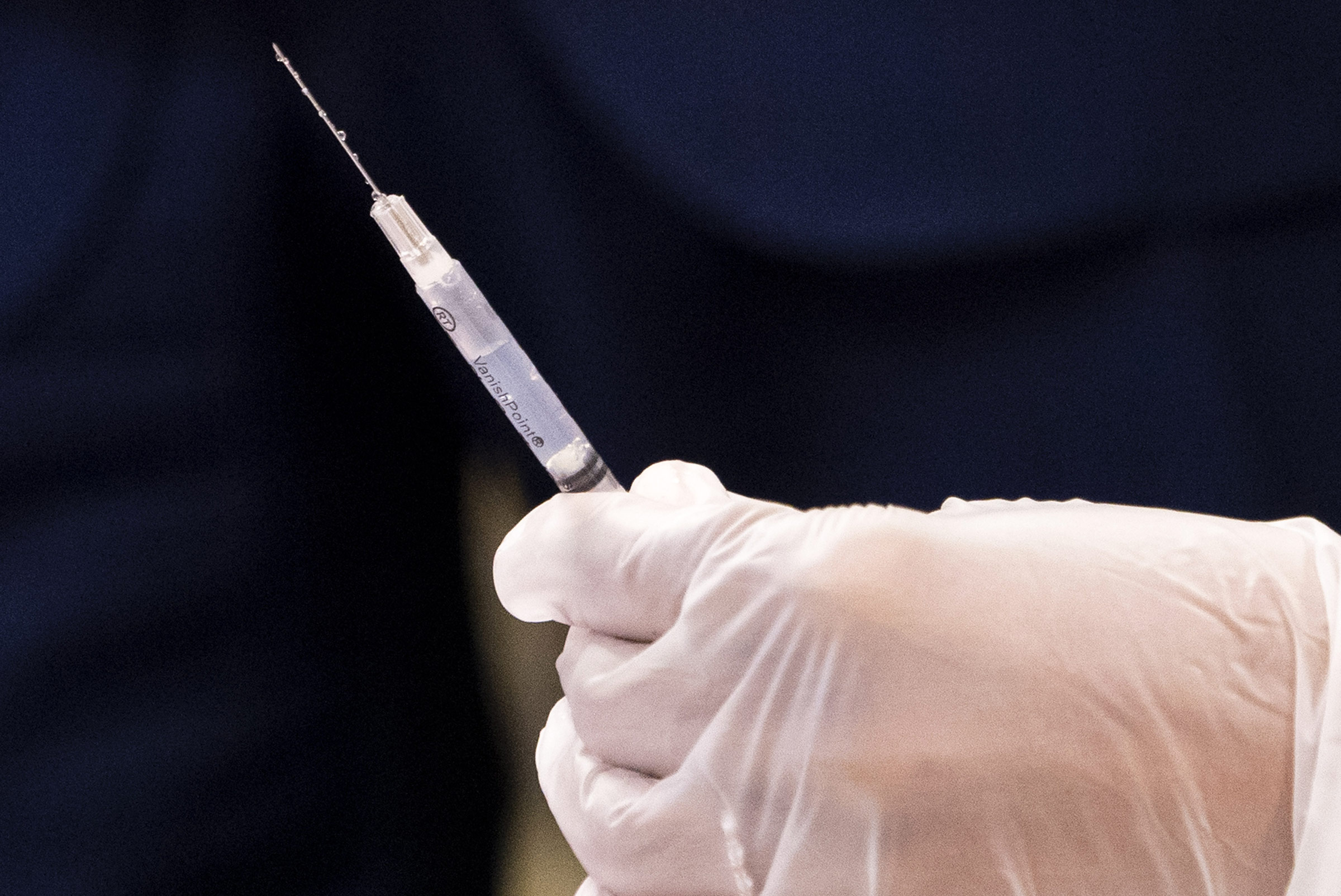A healthcare worker prepares a Covid-19 vaccine at a vaccination site in Washington, DC, on Monday, March 8. 