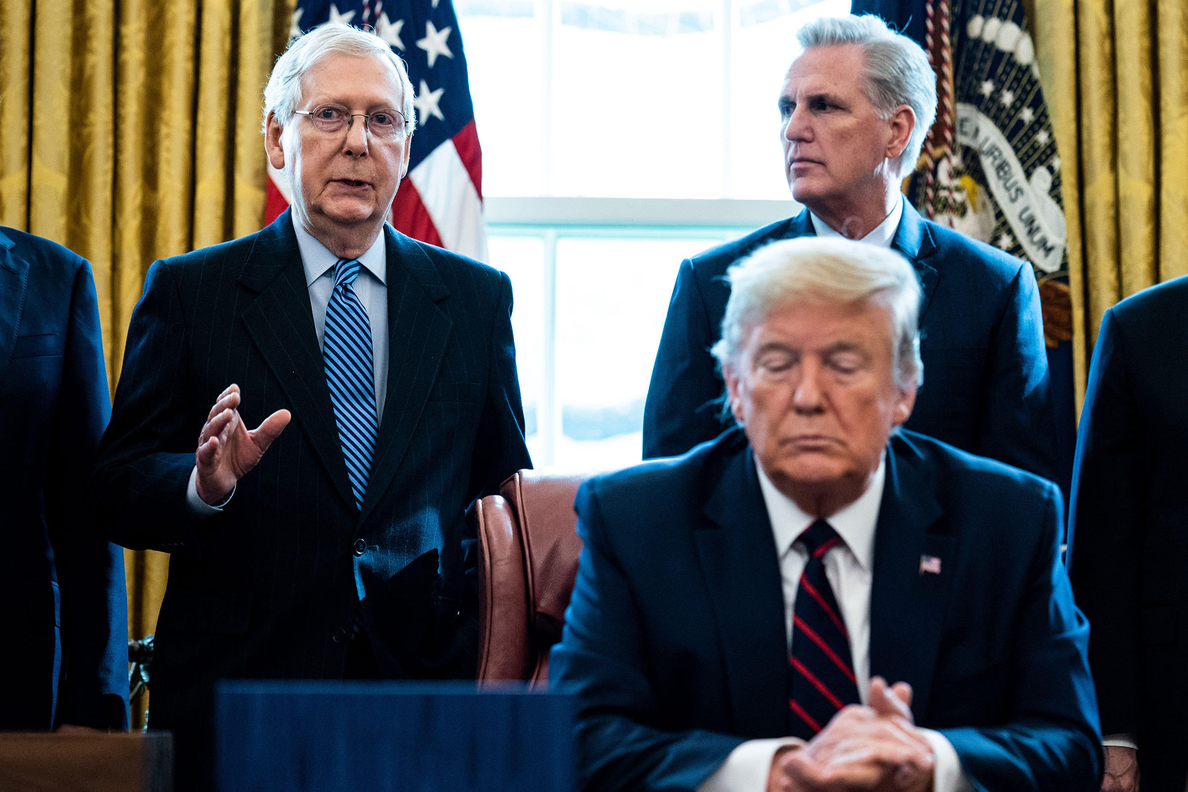 In this March 2020 photo, Sen. Mitch McConnell speaks as House Minority Leader Kevin McCarthy and President Donald Trump listen in the Oval Office of the White House in Washington, DC. 