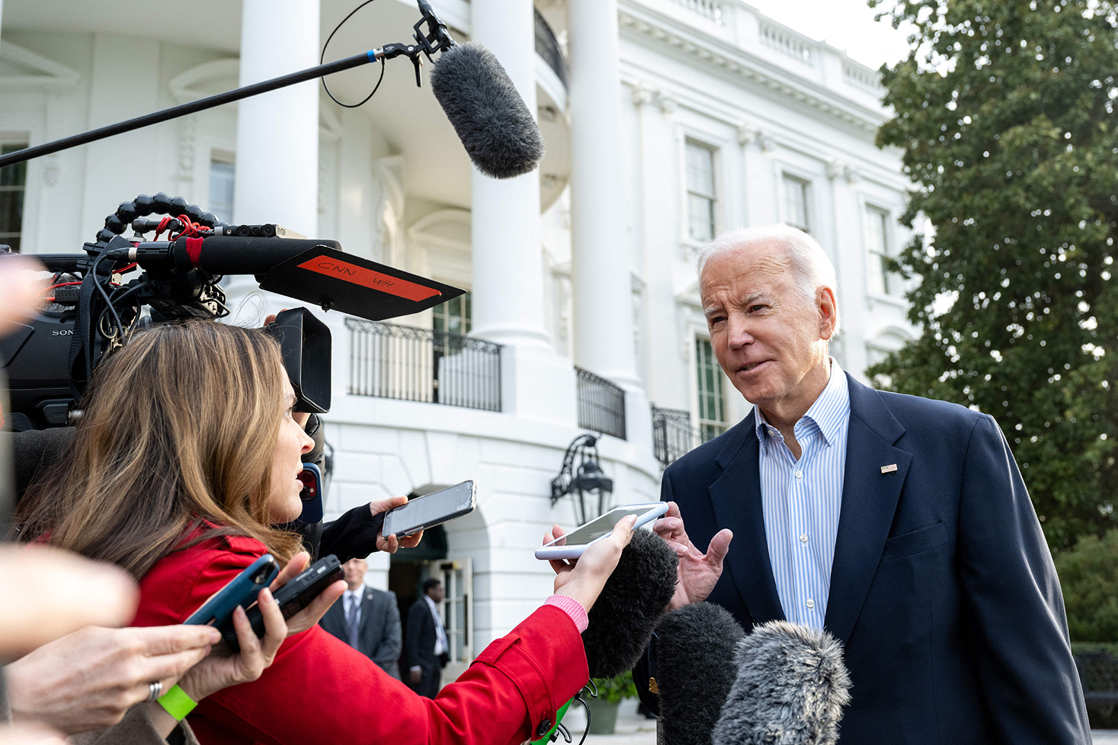 President Joe Biden speaks to the media as he walks to Marine One prior to departure from the South Lawn of the White House in Washington, DC, on March 31, as he travels to Mississippi to view tornado damage before going to Delaware for the weekend.