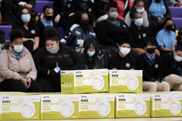 Students listen to a presentation before receiving KN95 protective masks as a precaution against the spread of the coronavirus at Camden High School in Camden, N.J., on Wednesday, Feb. 9. 