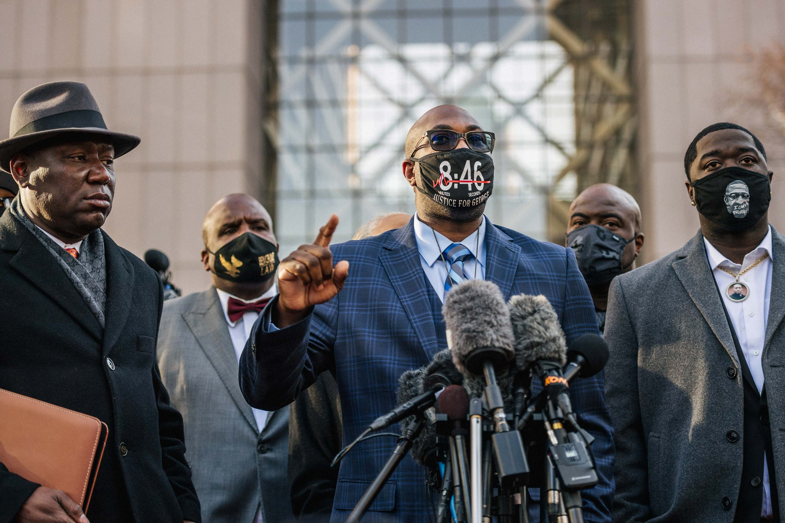Philonise Floyd, brother of George Floyd, speaks alongside attorney Ben Crump, left, and Brandon Williams, nephew of George Floyd, right, during a news conference outside the Hennepin County Government Center on March 29 in Minneapolis, Minnesota. 