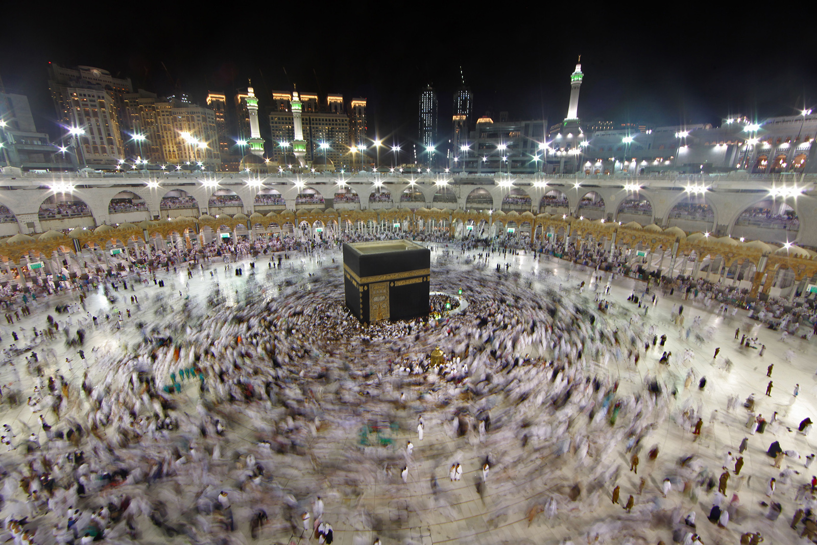 In this June 14, 2018 file photo, Muslim worshippers gather at the Grand Mosque in Islam's holiest city of Mecca as they perform the Umrah, or lesser pilgrimages, during the last week of the month of Ramadan. 