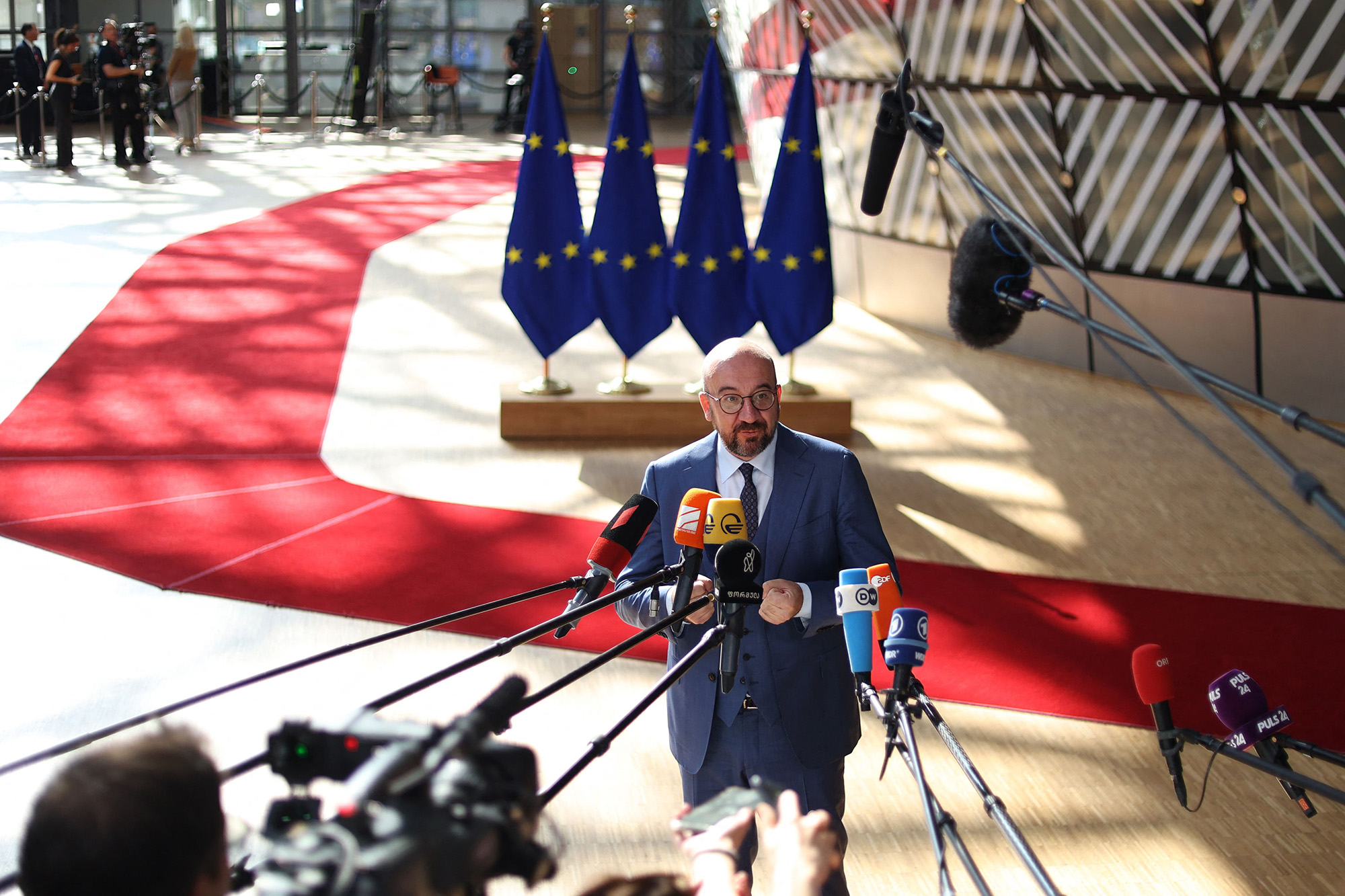 President of the European Council Charles Michel speaks to the press as he arrives for the EU-Western Balkans leaders' meeting in Brussels, Belgium, on June 23.