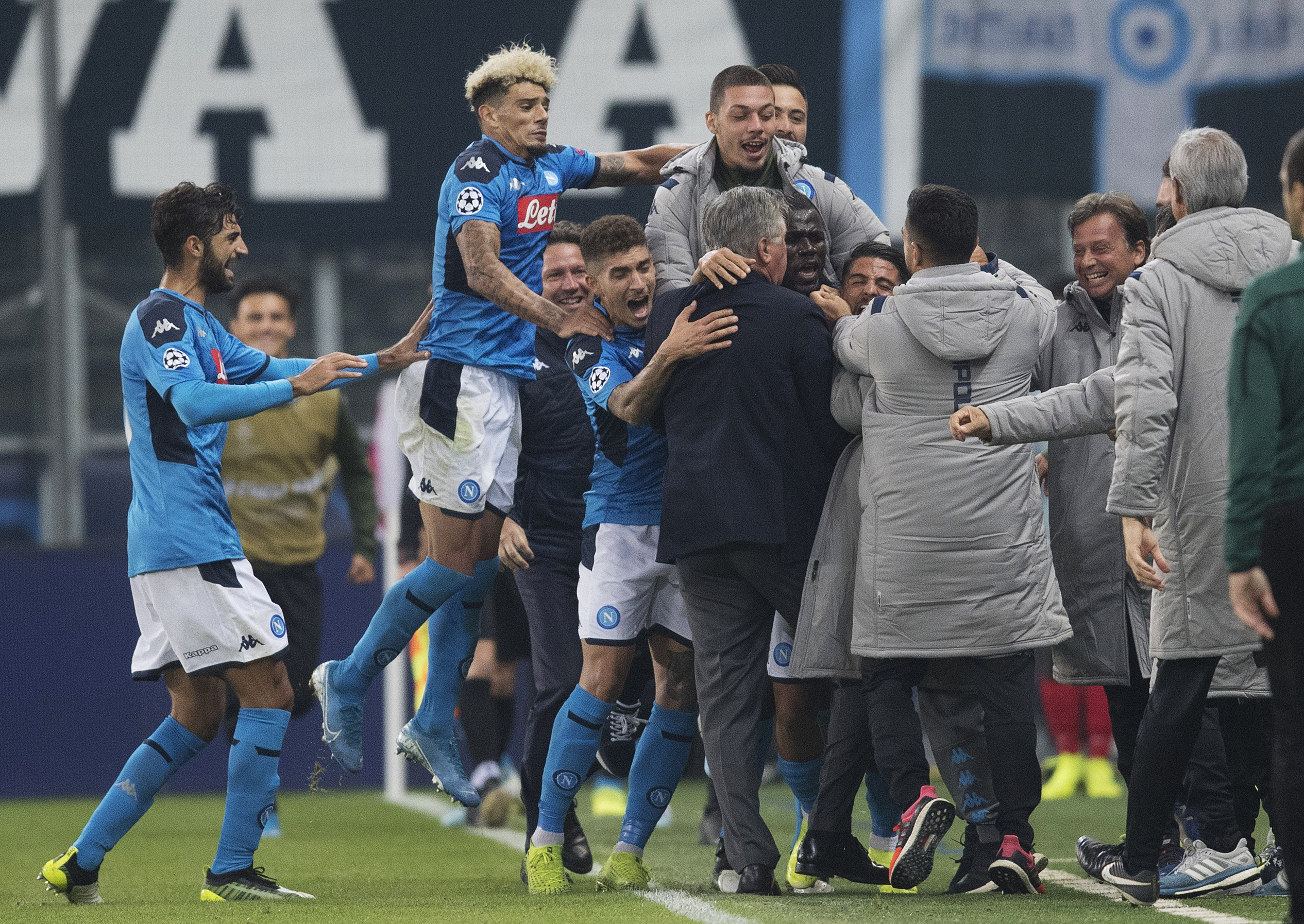 Napoli players celebrate the winning goal against Salzburg.