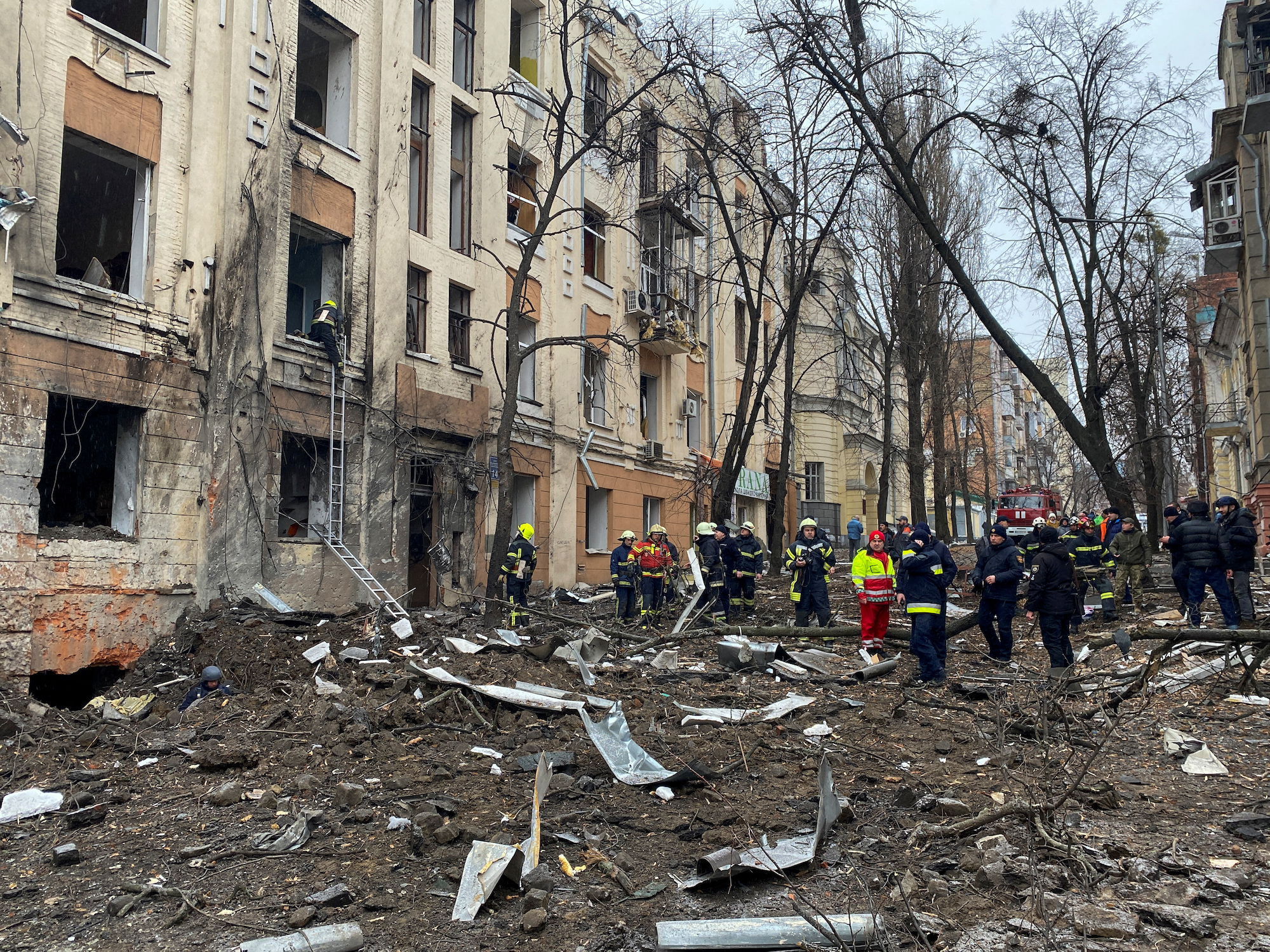 Rescuers work at a site of a residential building damaged by a Russian missile strike in central Kharkiv on Sunday.