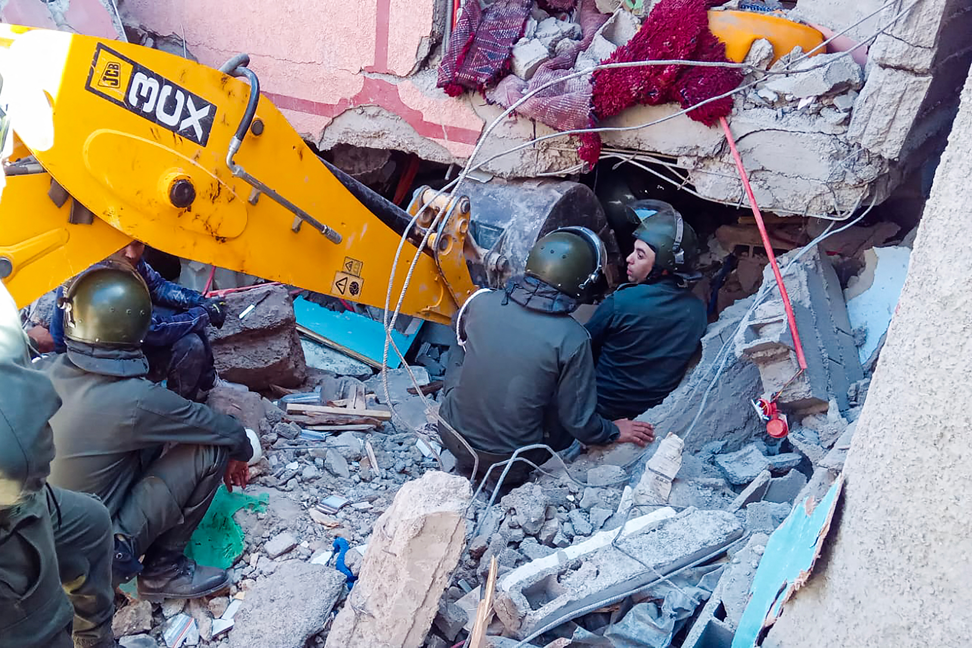Rescue workers search for survivors in a collapsed house in Al Haouz province, Morocco, on September 9. 