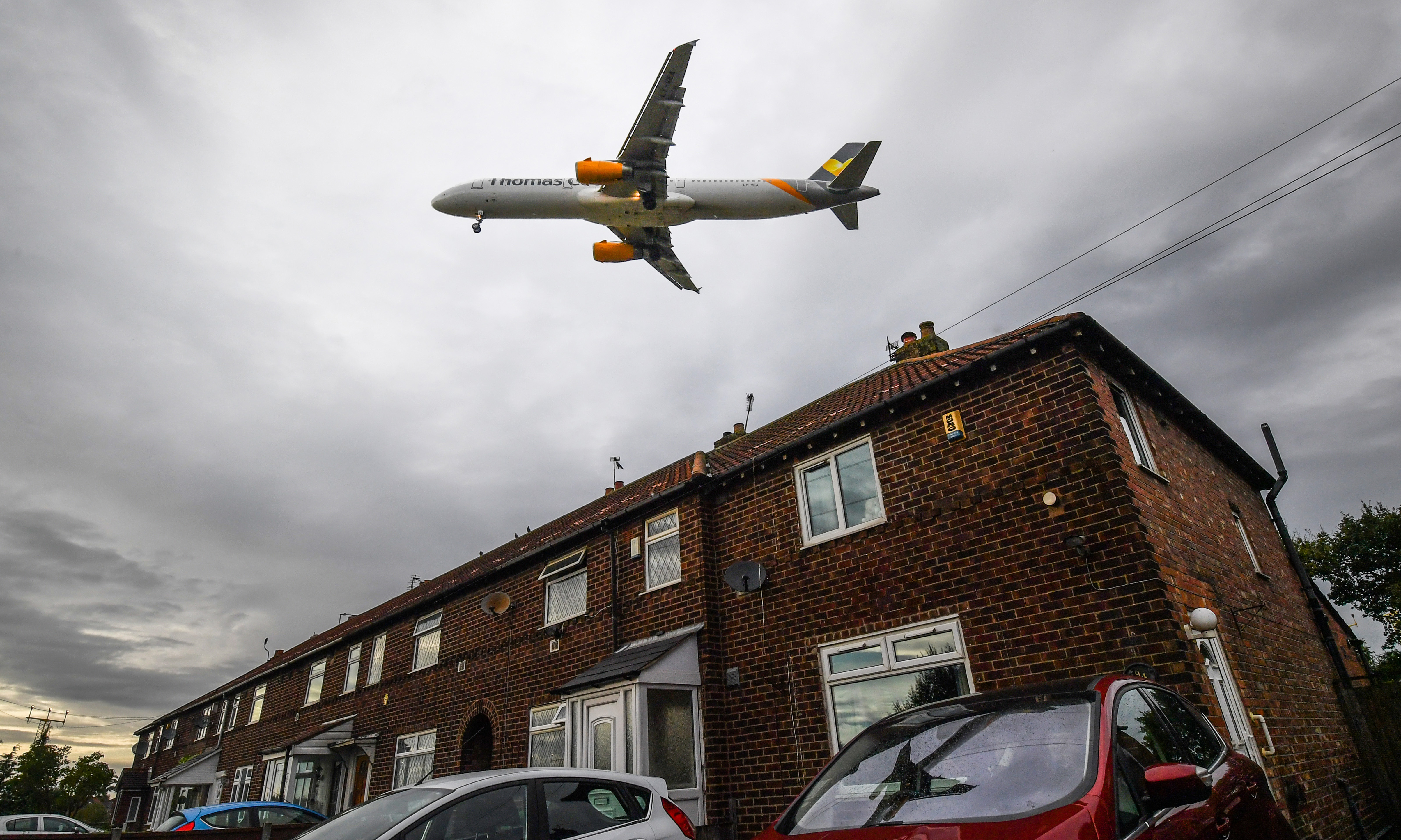 A Thomas Cook flight comes in to land above residential houses close to Manchester Airport on September 22, 2019.