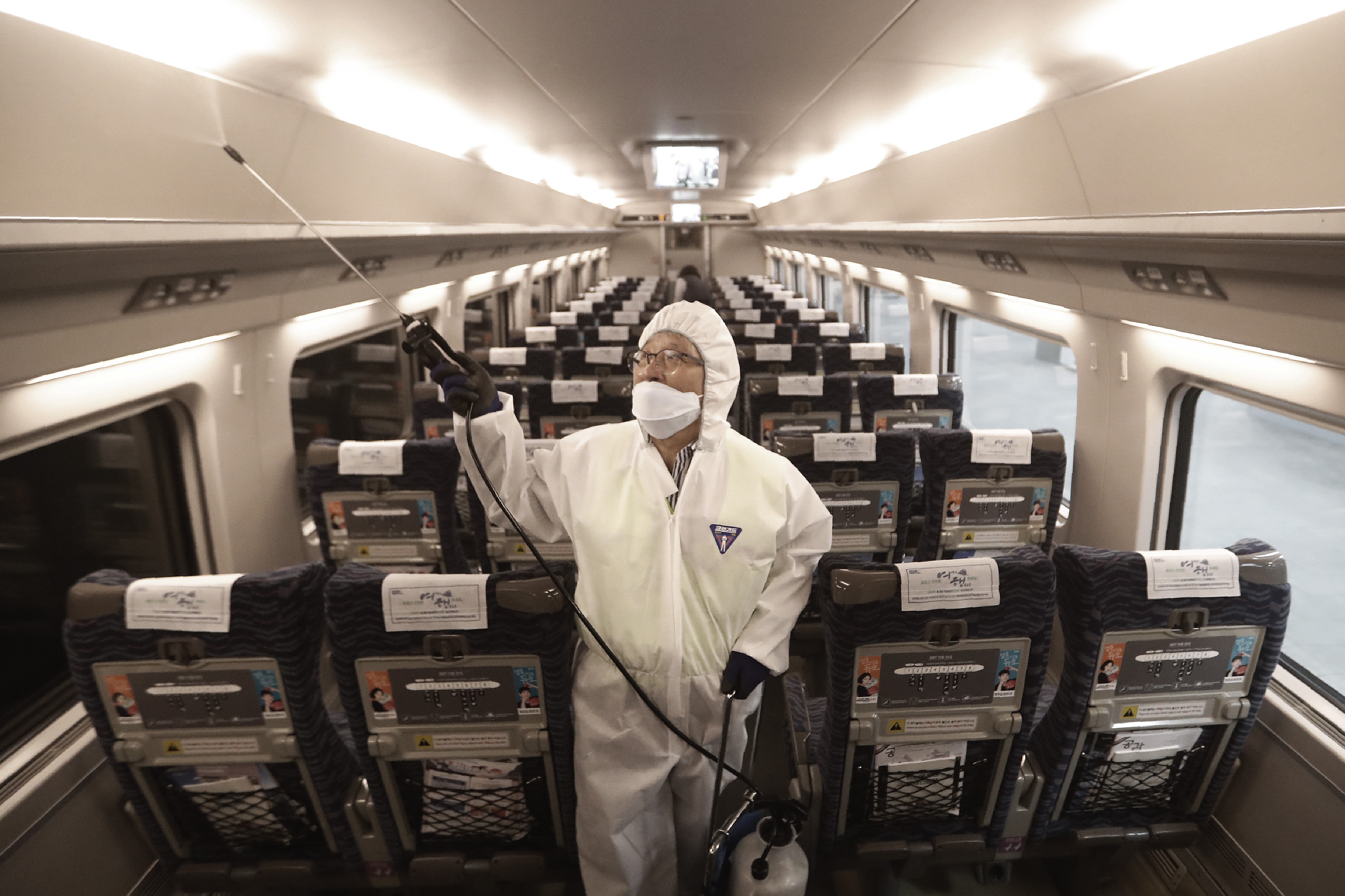 Disinfectant is sprayed on a train as a precaution against the coronavirus in Seoul, South Korea, on January 24.