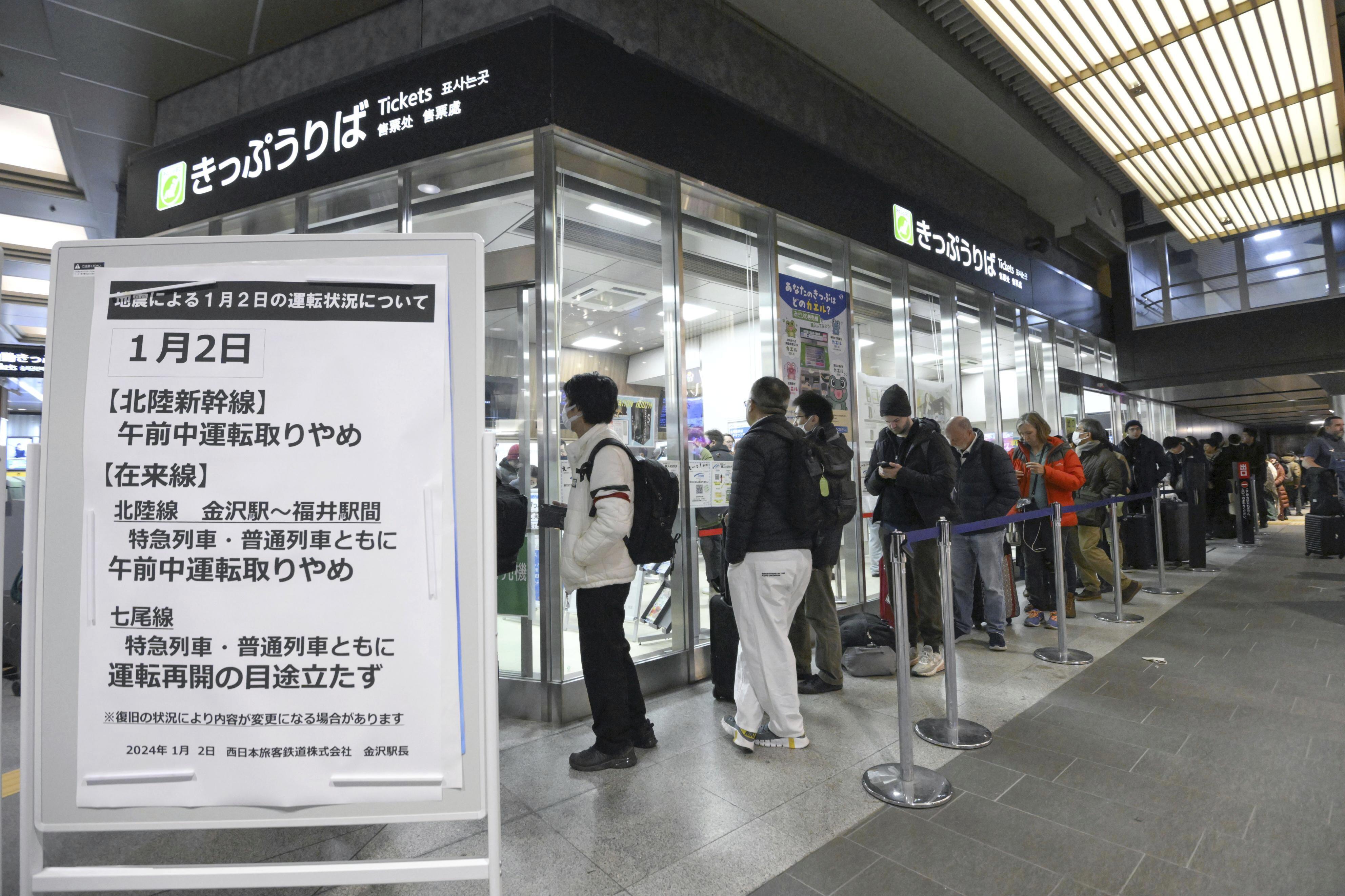 Passengers make a line in front of a ticket counter at JR Kanazawa station in Kanazawa, Ishikawa prefecture, Japan, on January 2, as some train services were cancelled following the earthquake.