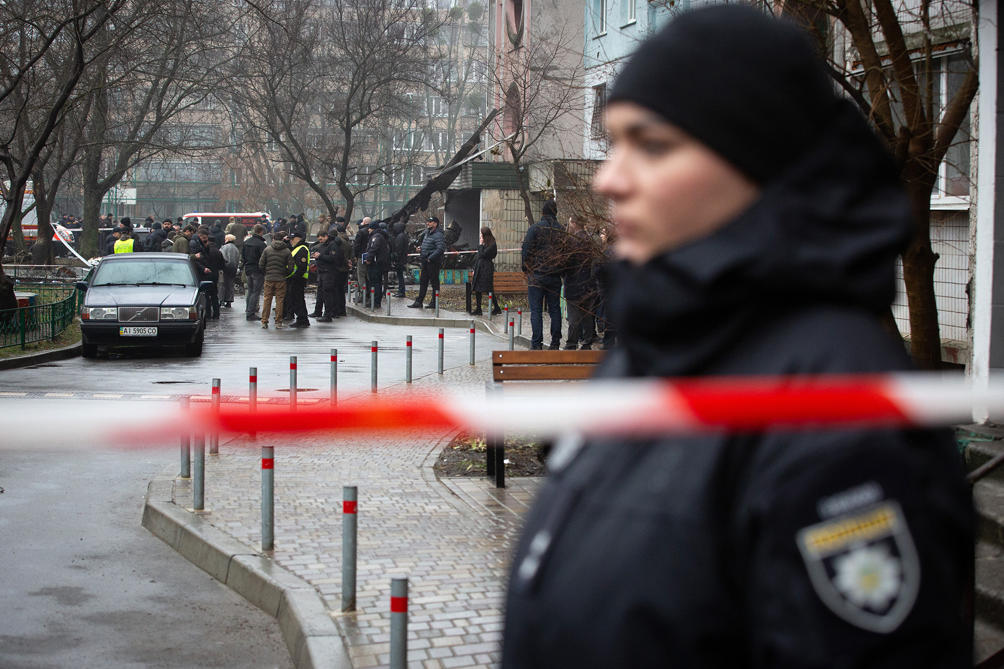 Police cordon off the site where a helicopter crashed in Brovary, Ukraine, on January 18.