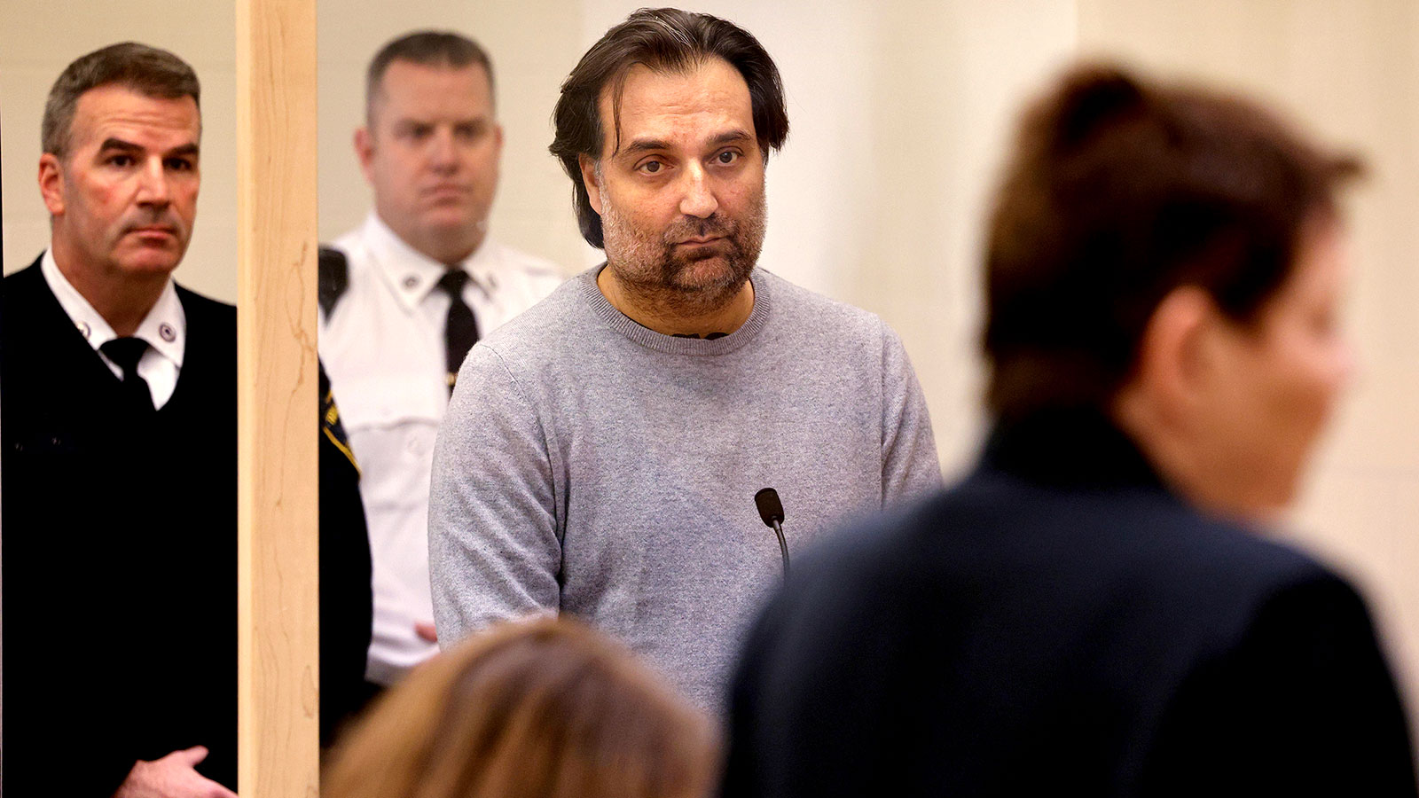 Brian Walshe, center, listens during his arraignment on January 18 at Quincy District Court, in Quincy, Massachusetts.