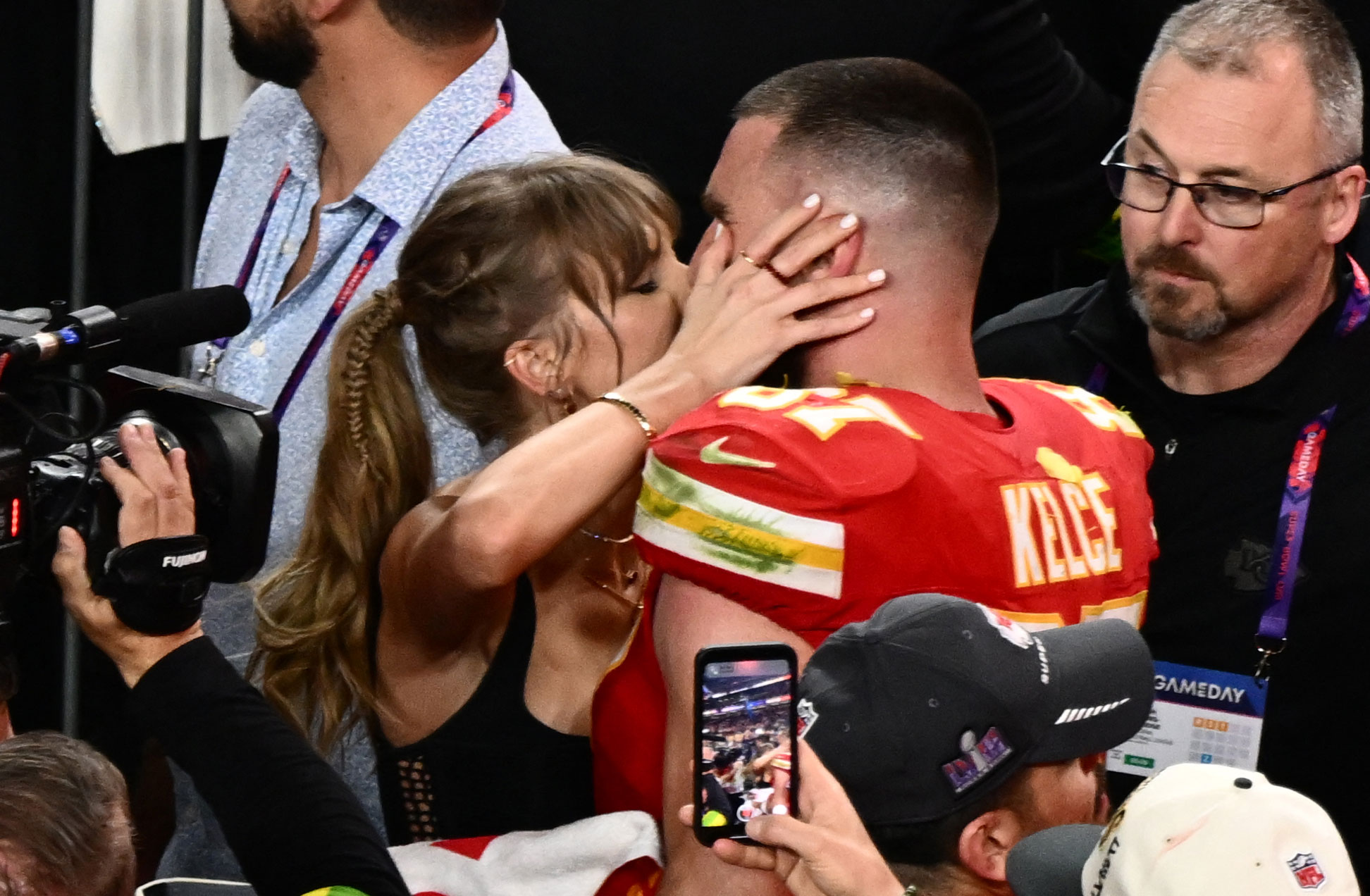 Taylor Swift kisses Travis Kelce after the Chiefs won the Super Bowl.
