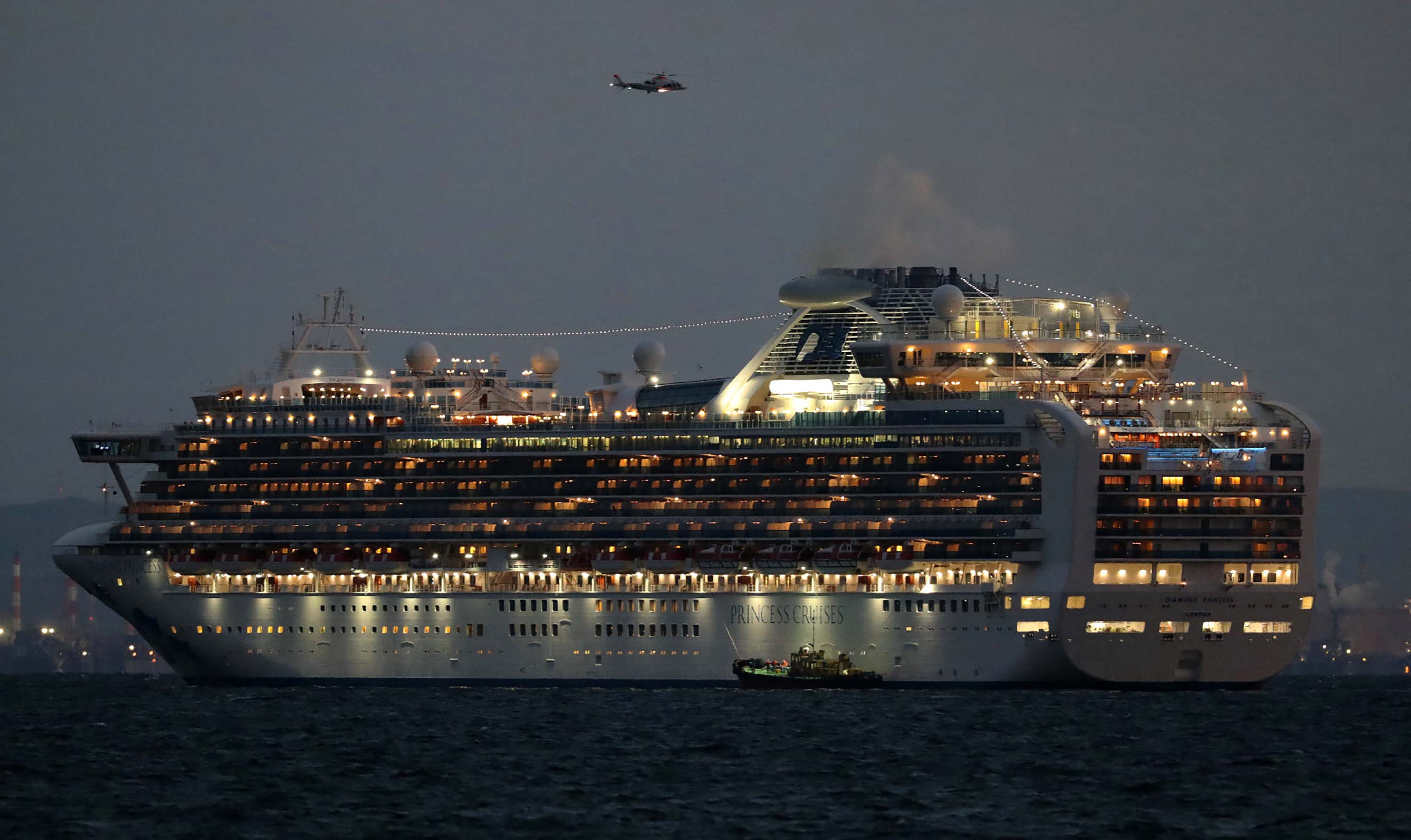 The Diamond Princess cruise ship sits anchored in quarantine off the port of Yokohama, Japan, on Tuesday.