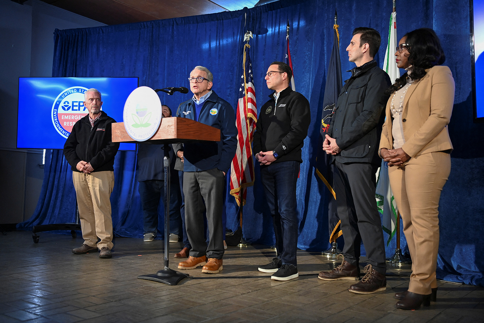 Ohio Governor Mike DeWine, flanked by other local, state and national leaders, addresses the press on February 21.