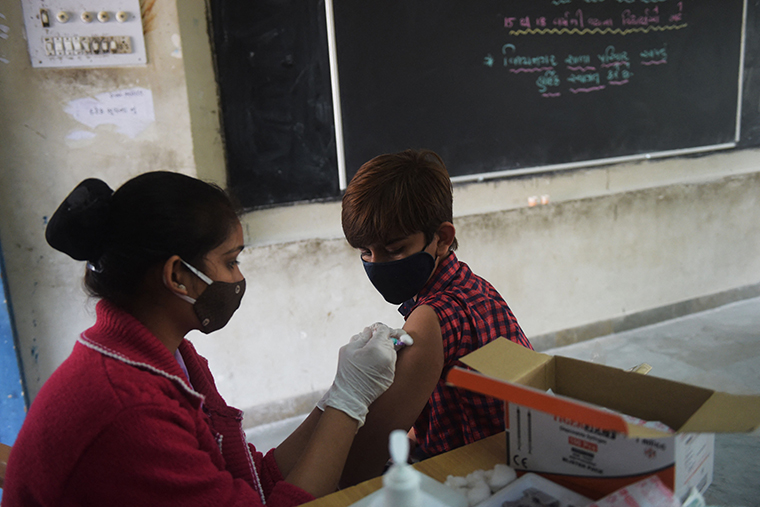 A health worker inoculates a dose of the Covaxin vaccine against the Covid-19 coronavirus to a student during a vaccination drive for people in the 15-18 age group at a secondary school in Ahmedabad on January 3.
