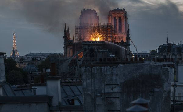 Smoke and flames rise from the cathedral.