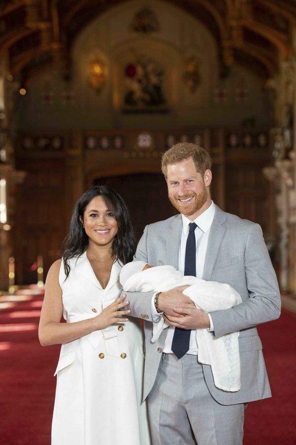 Britain's Prince Harry and Meghan, Duchess of Sussex, during a photocall with their newborn son, in St George's Hall at Windsor Castle.