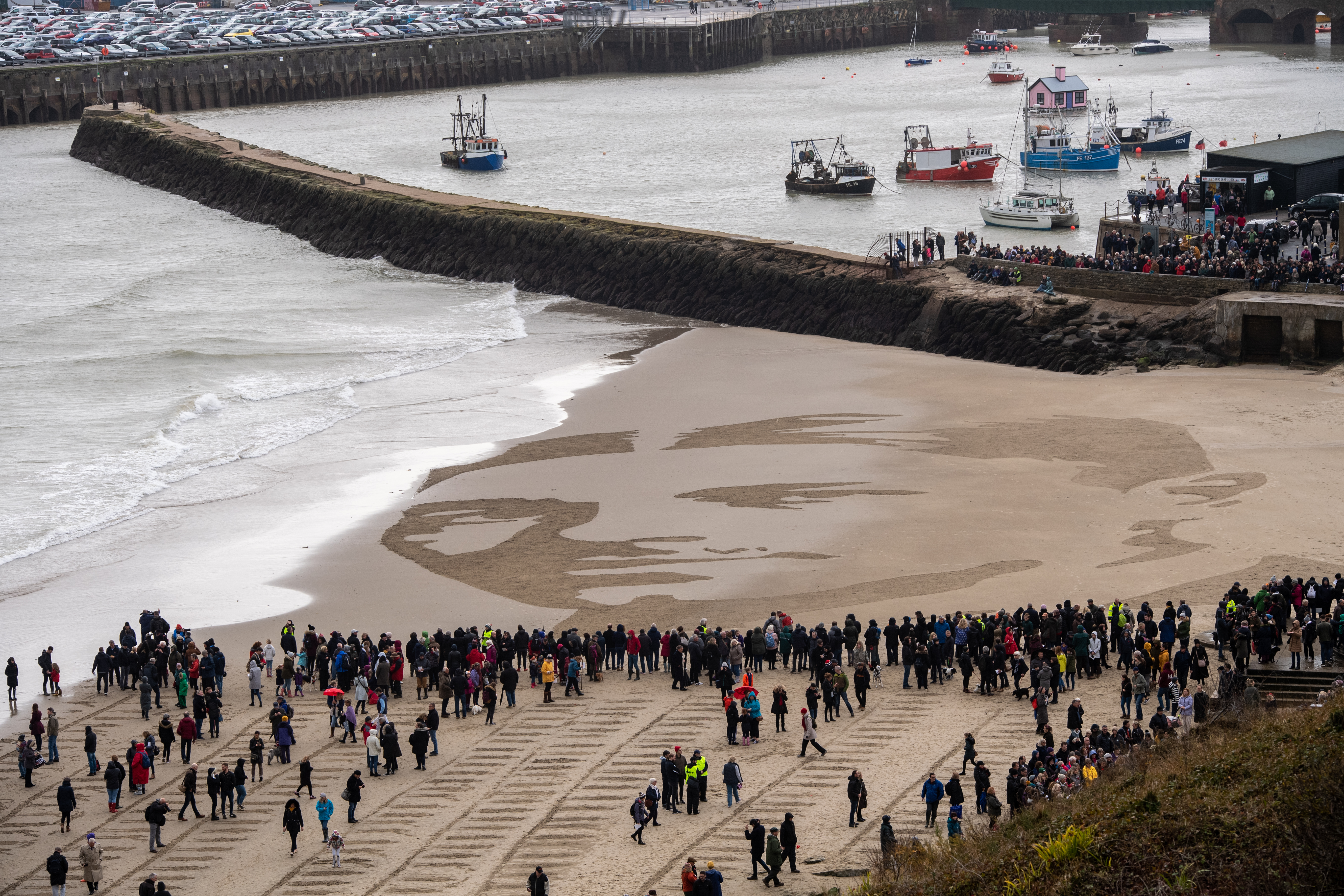 Visitors gather at Sunny Sands Beach, Folkestone, in south east England, to see the art installation. 