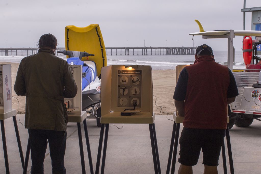 Voters cast their ballots at a Los Angeles County lifeguard headquarters at Venice Beach on June 5, 2018 in Los Angeles, California