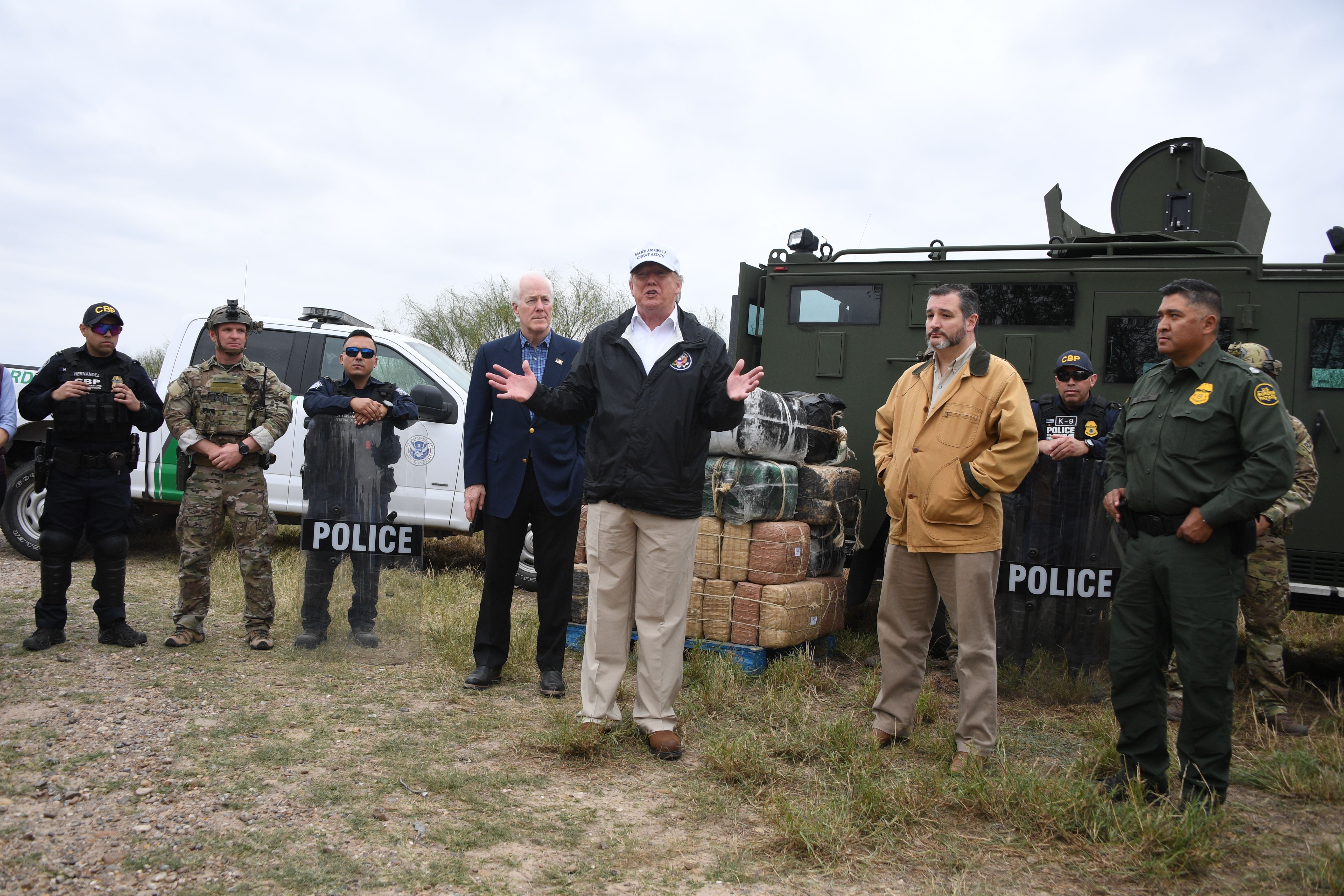 President Trump speaks after he received a briefing on border security next to Sen. John Cornyn (L) and Sen. Ted Cruz (2ndR) near the Rio Grande in McAllen, Texas, on Jan. 10, 2019. 