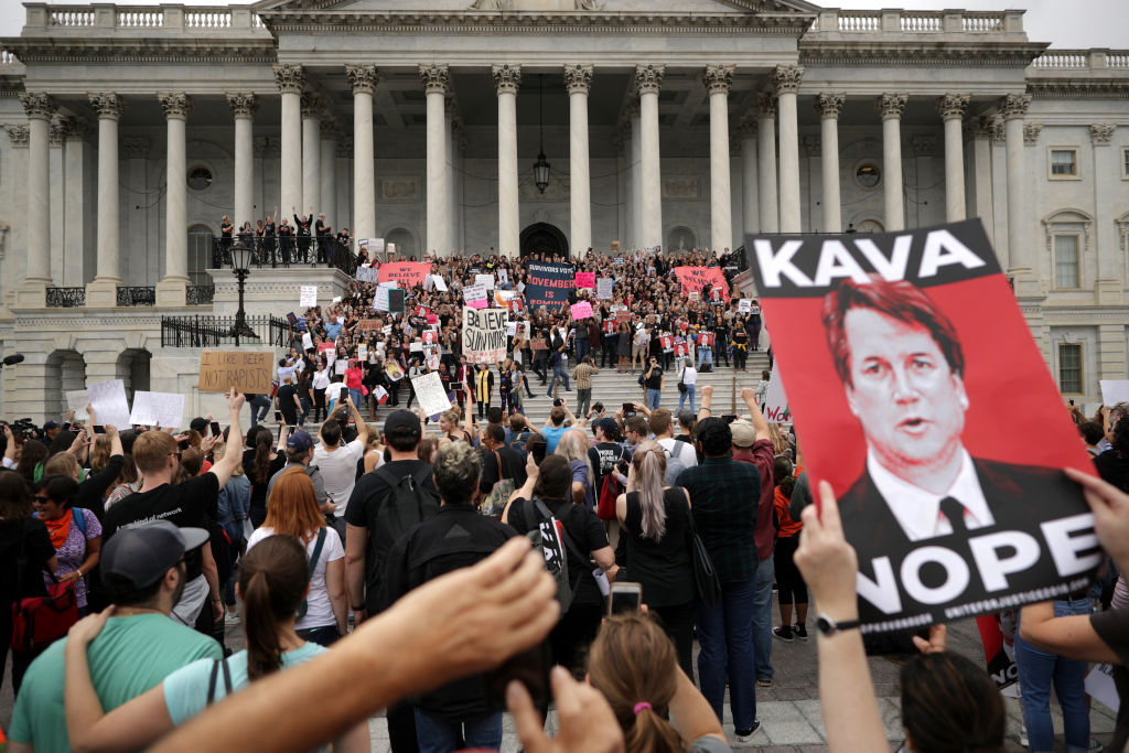 Protesters occupy the center steps of the East Front of the US Capitol after breaking through barricades to demonstrate against the confirmation of Supreme Court nominee Judge Brett Kavanaugh on Oct. 6, 2018 in Washington, DC.