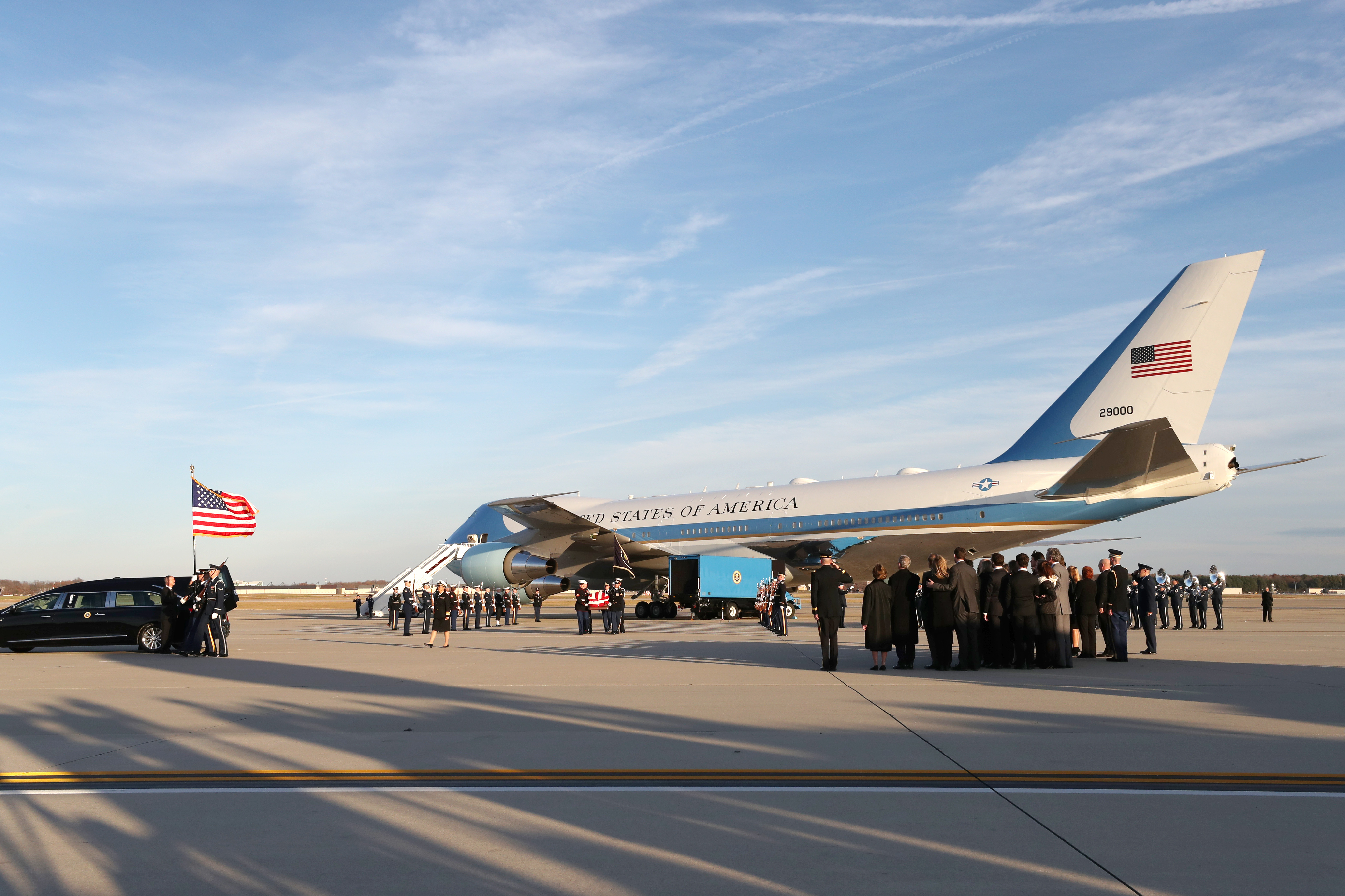 The casket of the remains of former US President George H.W. Bush is carried out of the US Air Force 747, being called 'Special Mission 41' on Dec. 3, 2018 in Joint Base Andrews, Maryland.