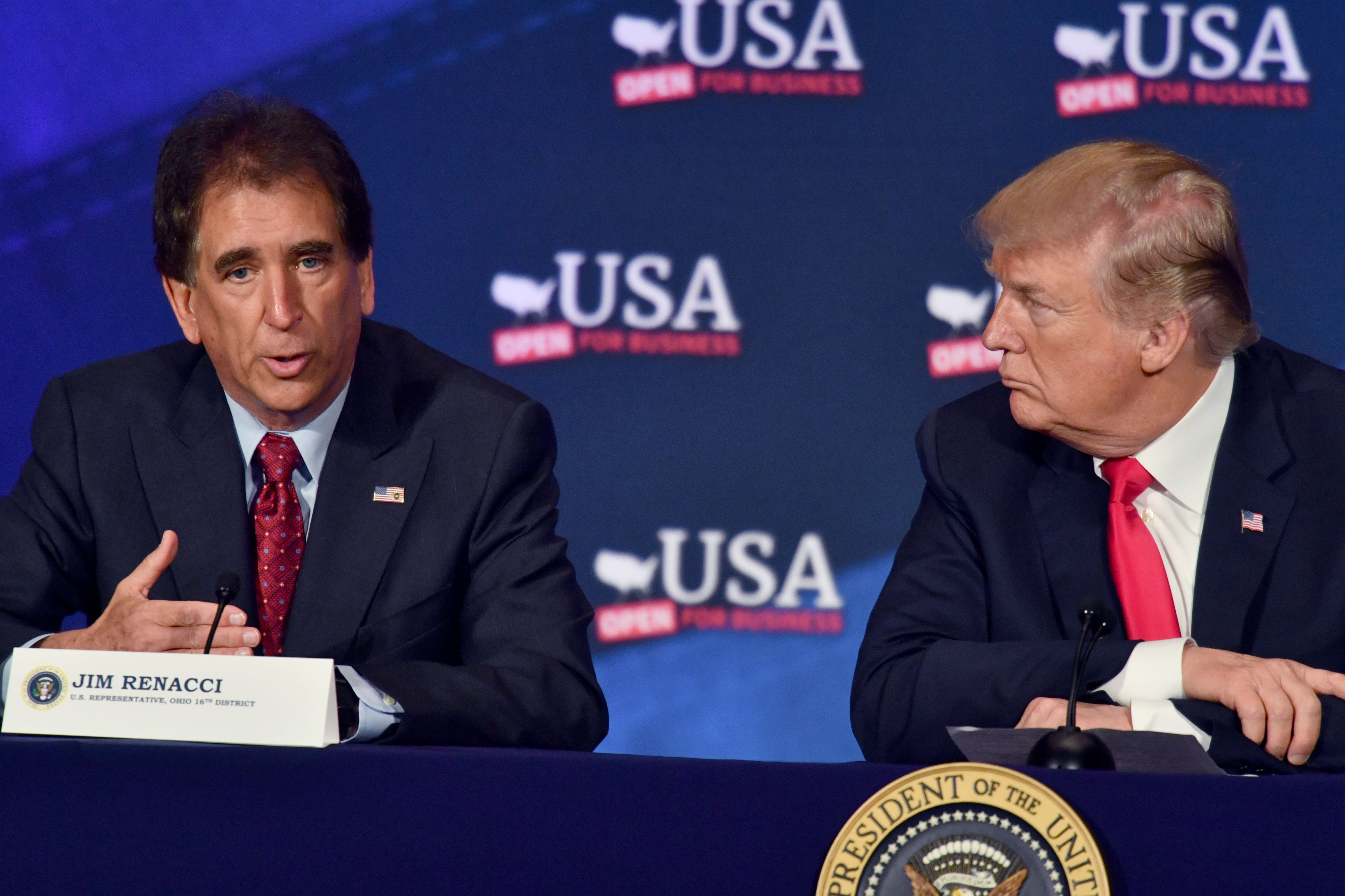 In this file photo, President Trump listens to Rep. Jim Renacci (L) during a roundtable discussion on the new tax law on May 5, 2018, in Cleveland, Ohio.