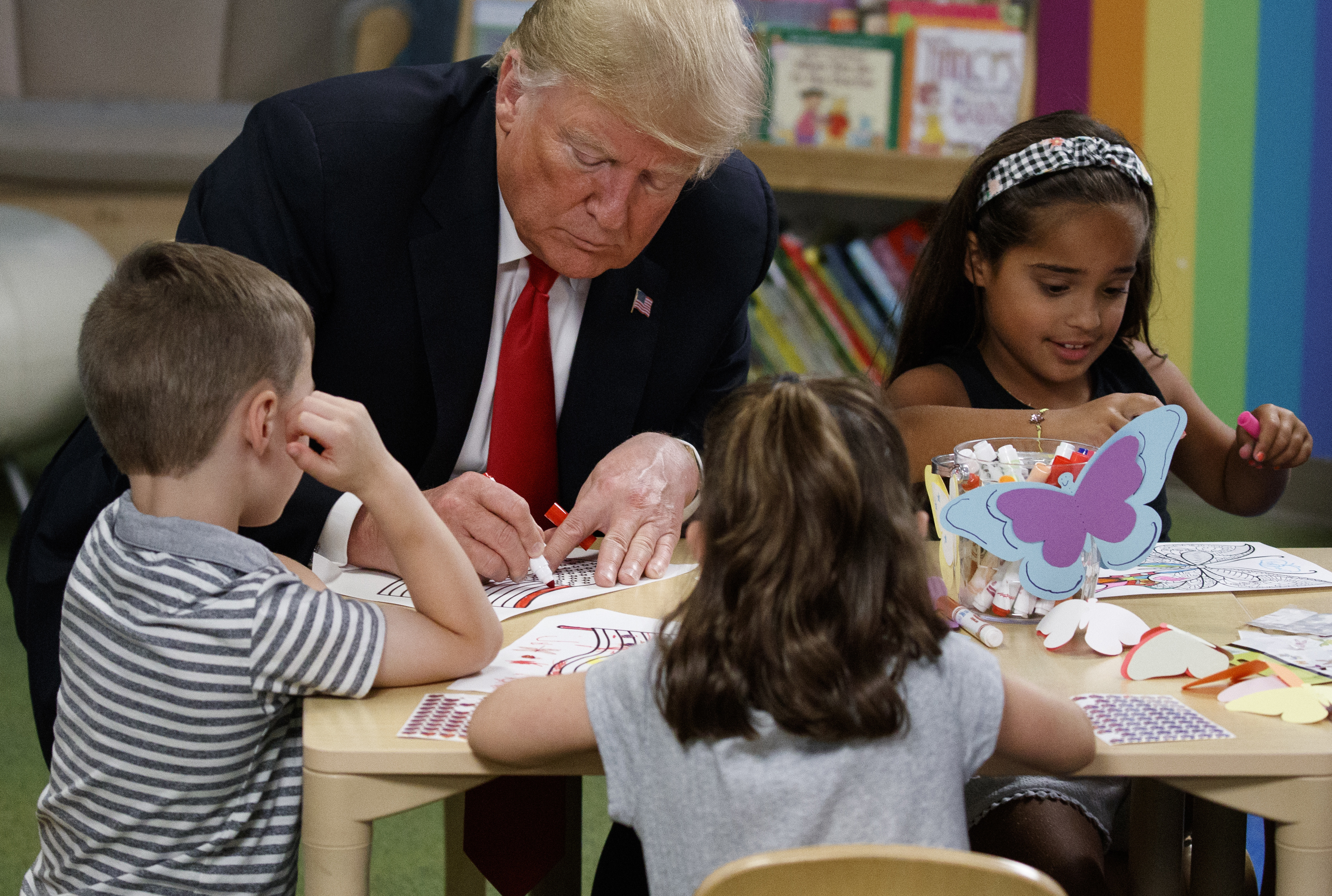 President Trump colors during a visit with a group of children at the Nationwide Children's Hospital on Aug. 24, 2018, in Columbus, Ohio. 